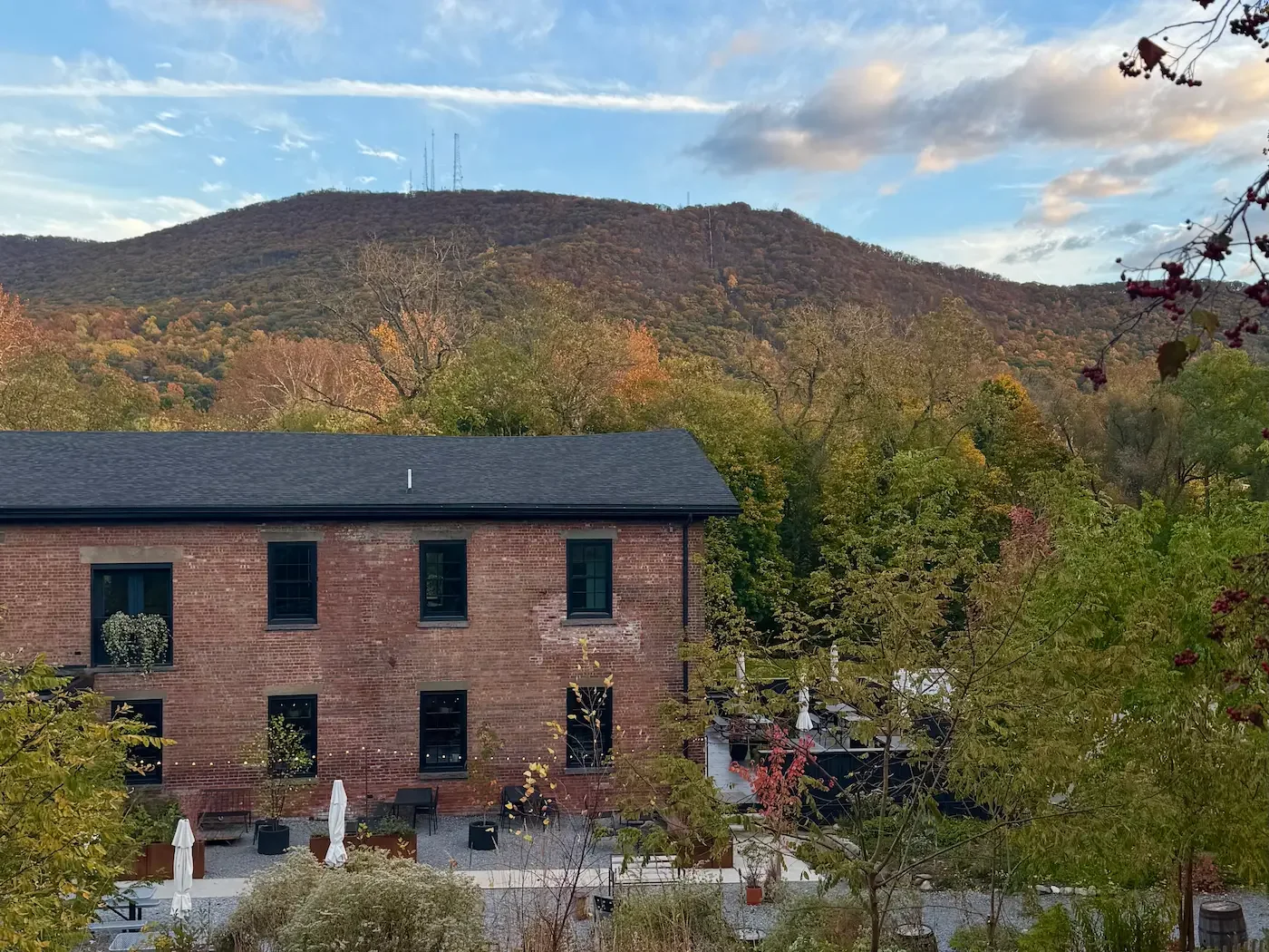 red brick brewery building with mount beacon in background