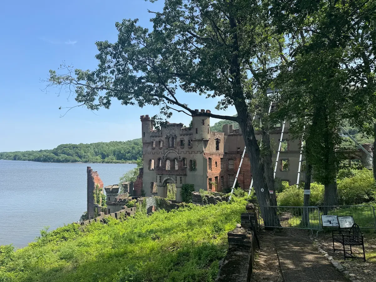a derelic castle on an island surrounded by a river