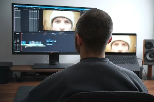 Close-up of a video editing timeline with multiple coloured tracks.