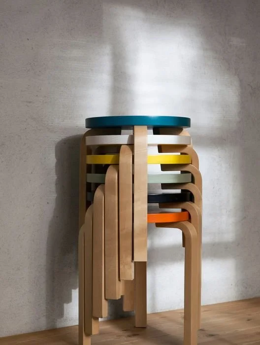 stacked-colorful-artek-stools-5f192c96fd88417889a09e7c585968de.jpg