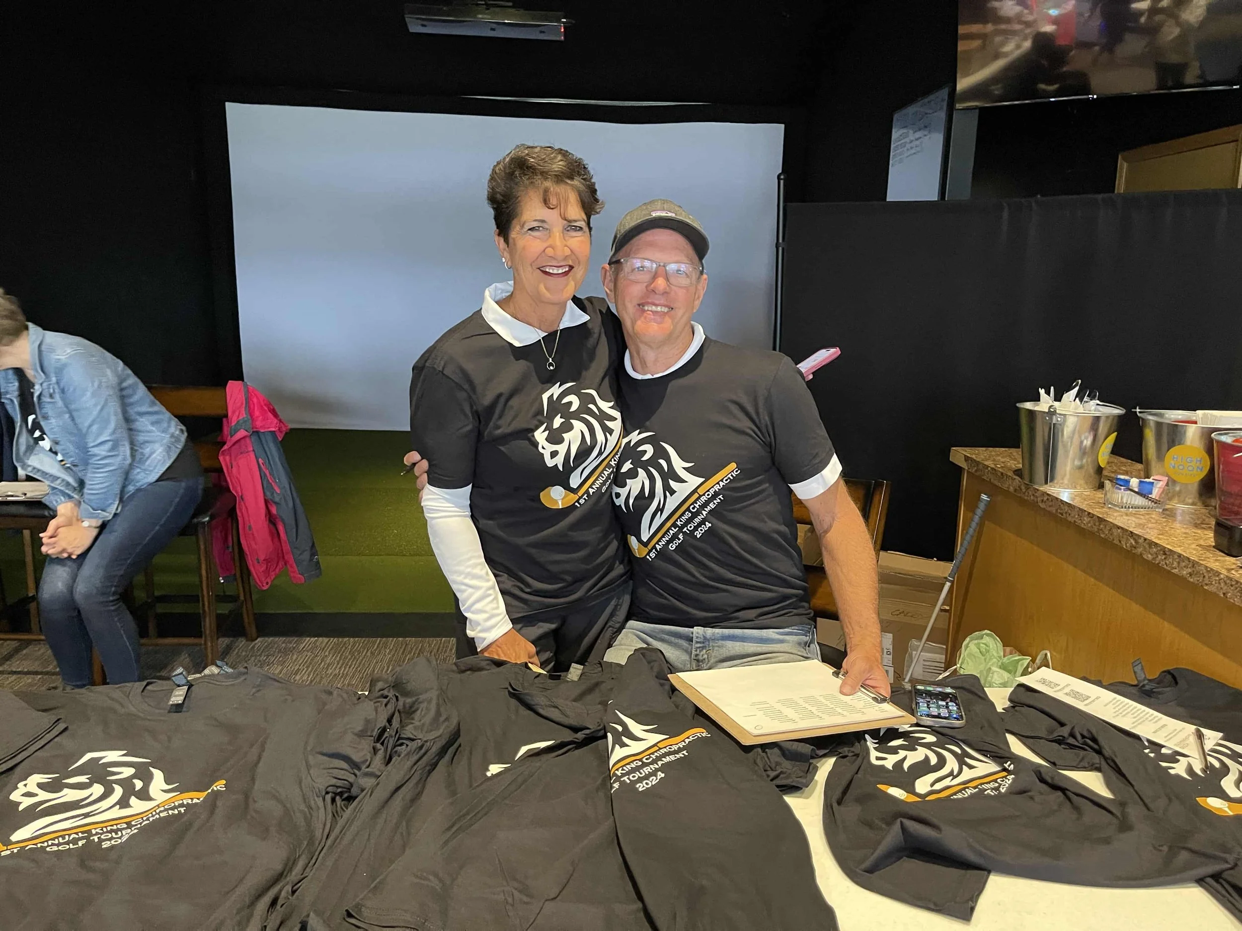 Volunteers handing out shirts for King Chiropractor in Delano MN