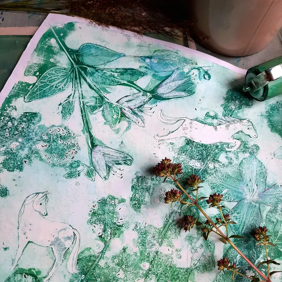 A botanical print with sketches of leaves, a horse, and a bird, along with a real plant on top, all in green tones.