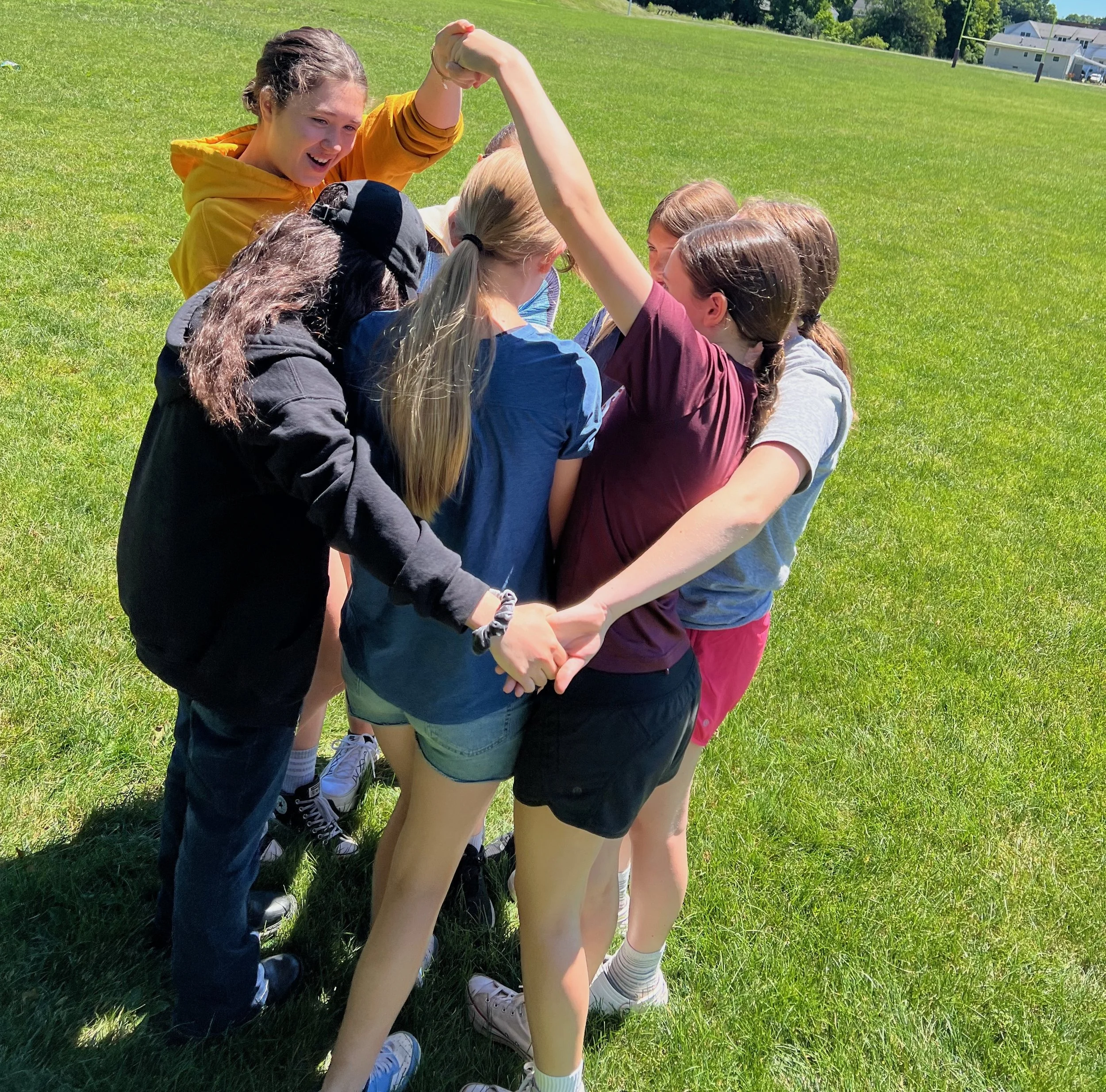 Girls in a hand-holding maze
