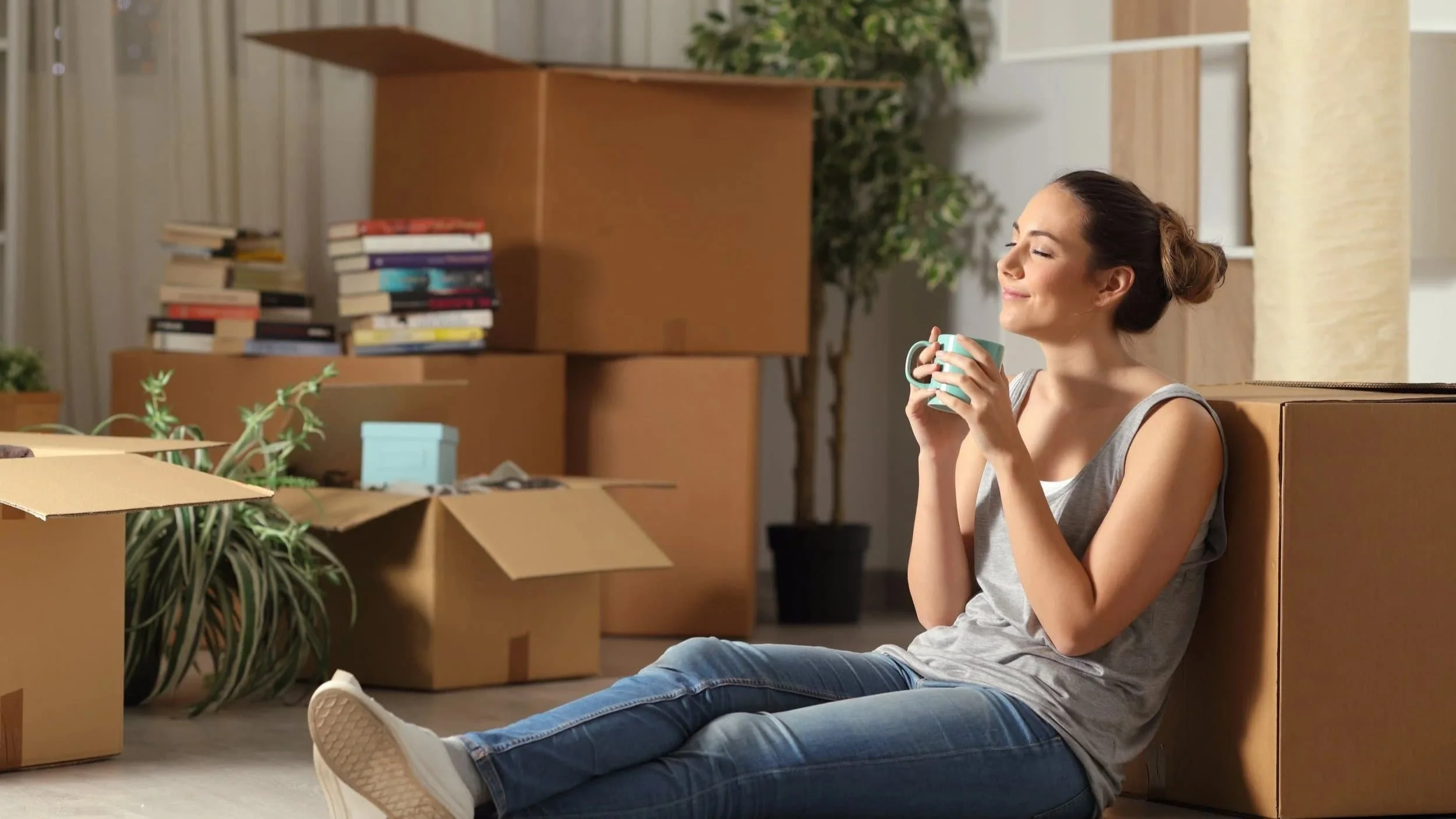 An image of a woman relaxing in her new home