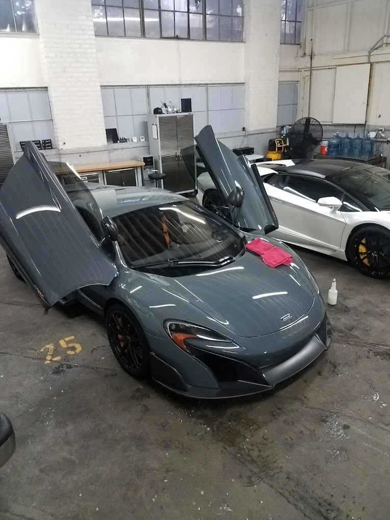 A McLaren undergoing professional paint correction in Pasadena