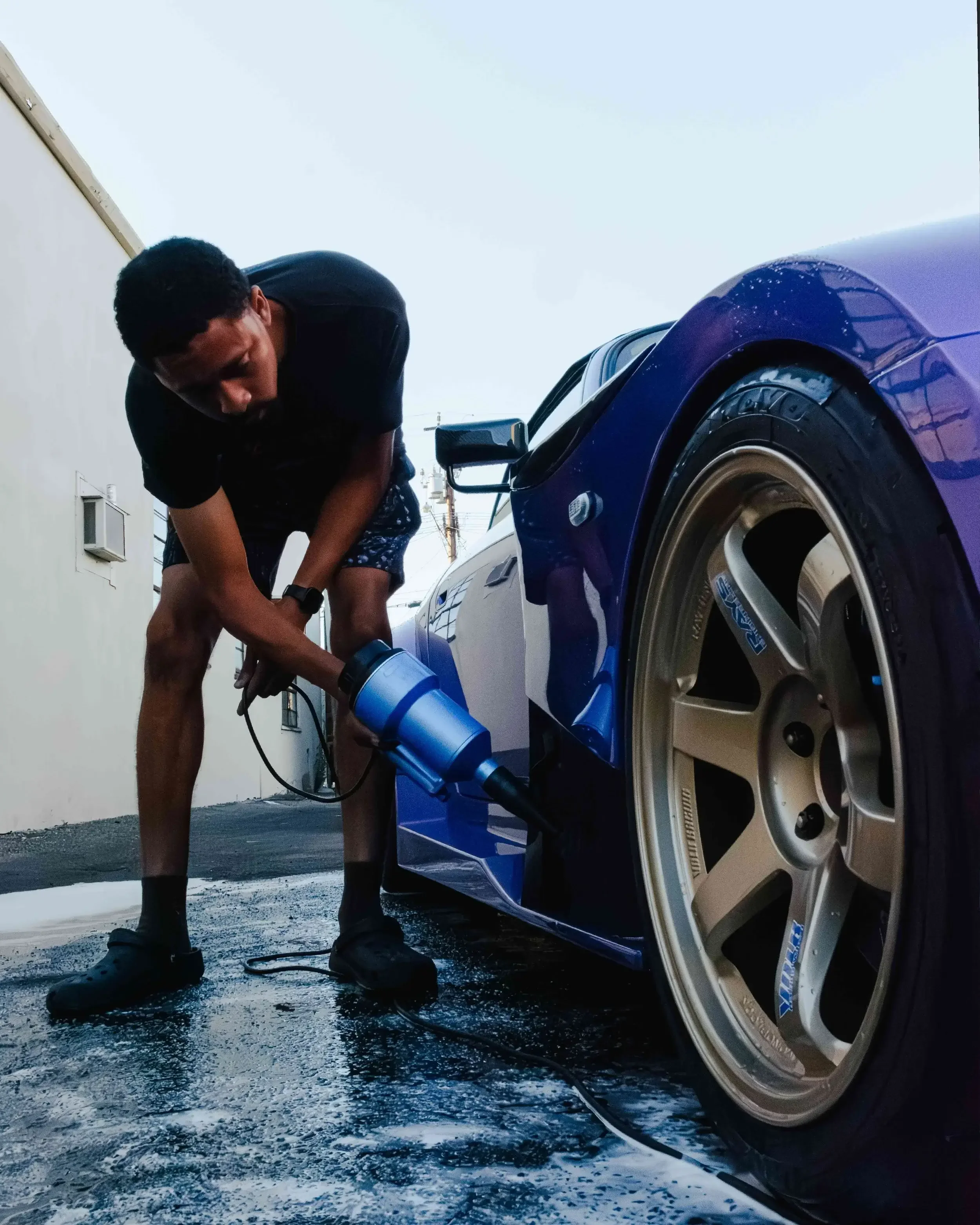 A freshly detailed wheel on a purple Honda S2000