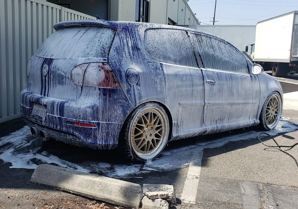 A perfectly clean blue car after a professional hand wash by Detailed By J.