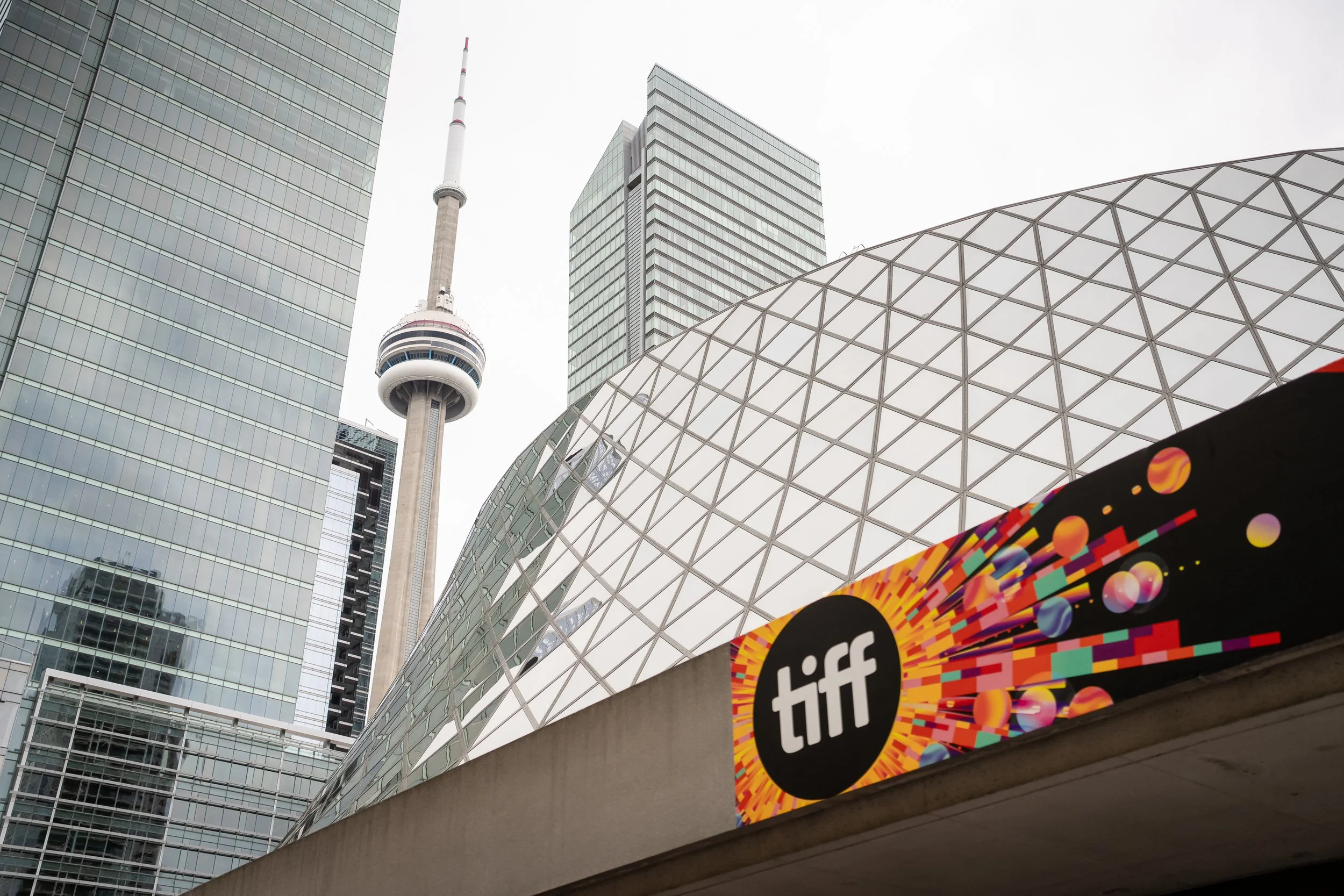 CN Tower with skyscrapers and TIFF sign in Toronto