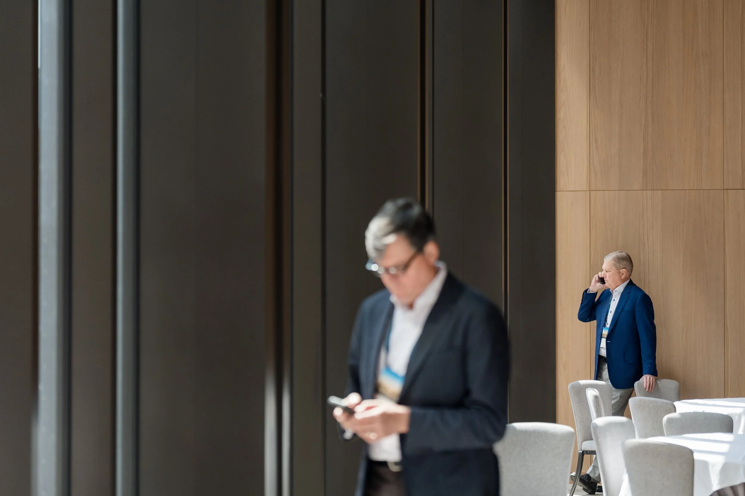 Business professionals networking and conversing in the open space at Park Hyatt Toronto during a corporate event.