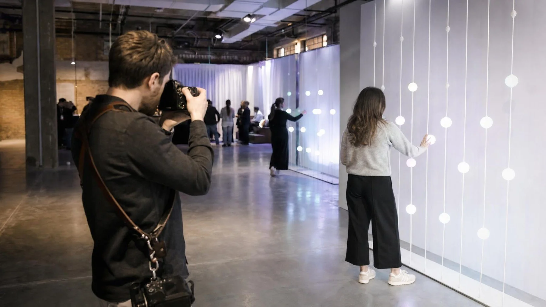 Uptown Media photographer documenting a branded Toronto activation for an agency and client brief