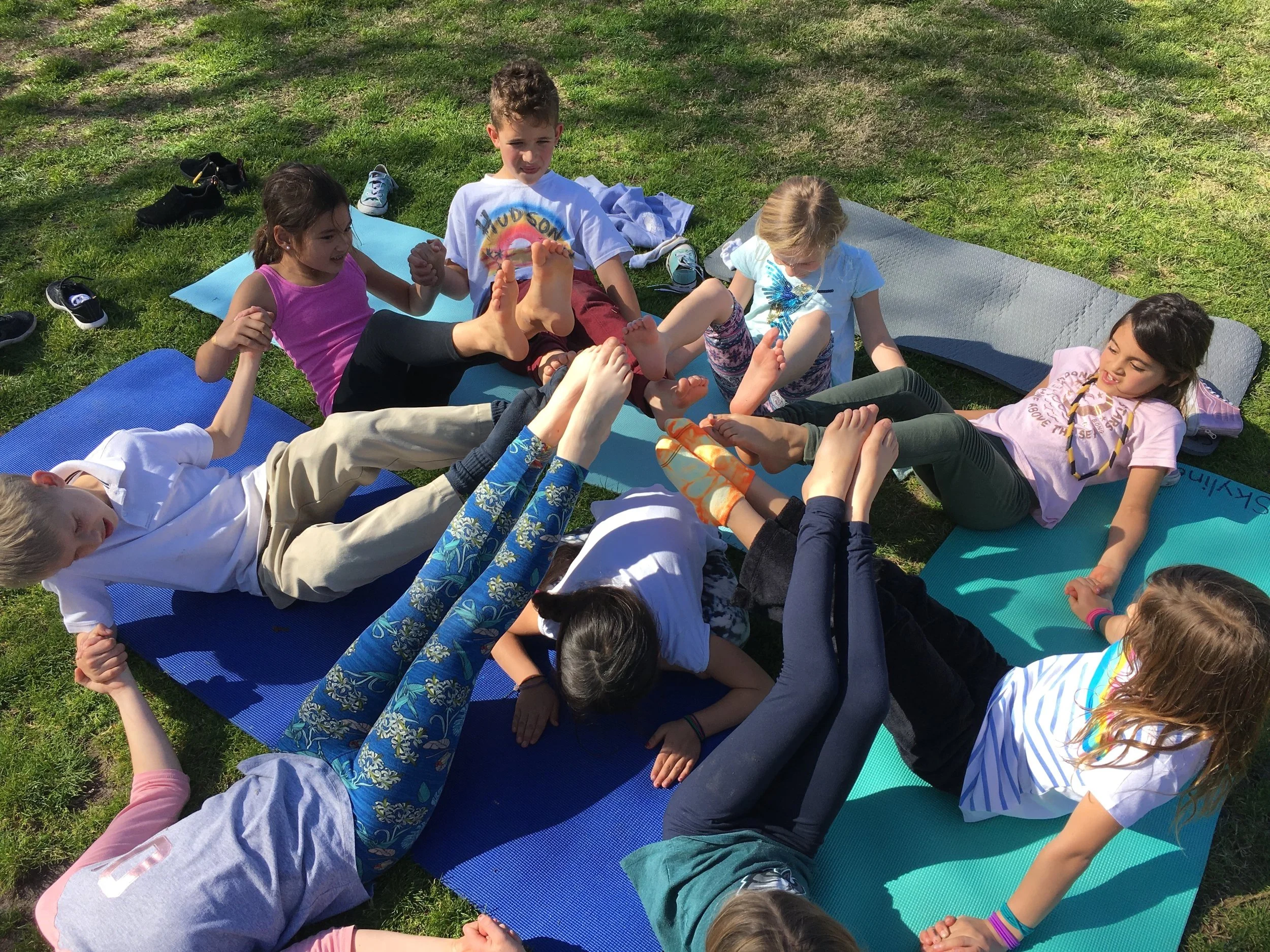 Krista Percival guiding school children outdoors in yoga fun at Skyline School, Mindful movement, Solana Beach, CA.
