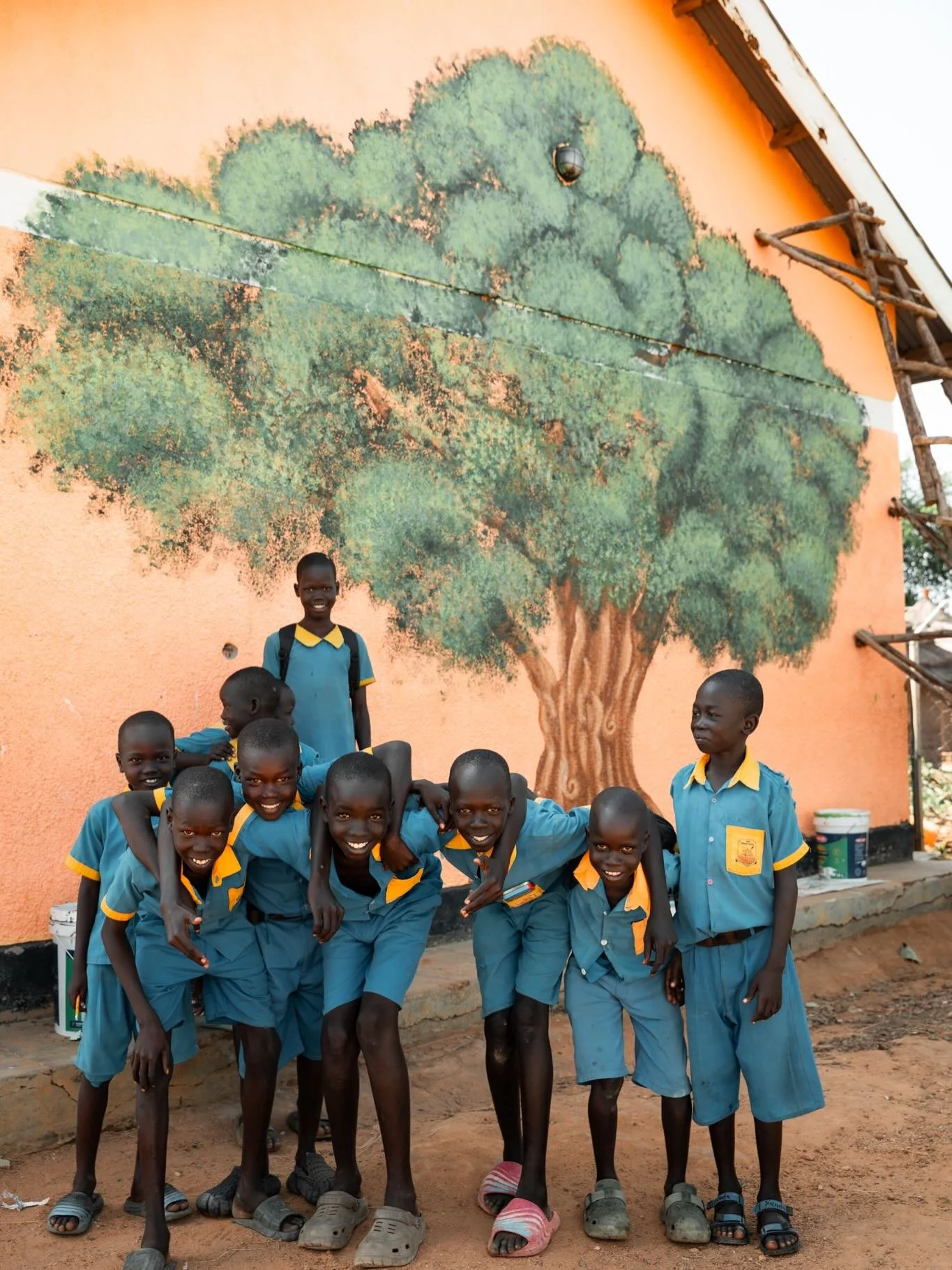 A few weeks ago, we shared that @emfritzzz was hard at work painting an incredible mural on the side of our classrooms. After days of creativity (and plenty of help from our amazing students) the mural was officially completed!

This tree represents 