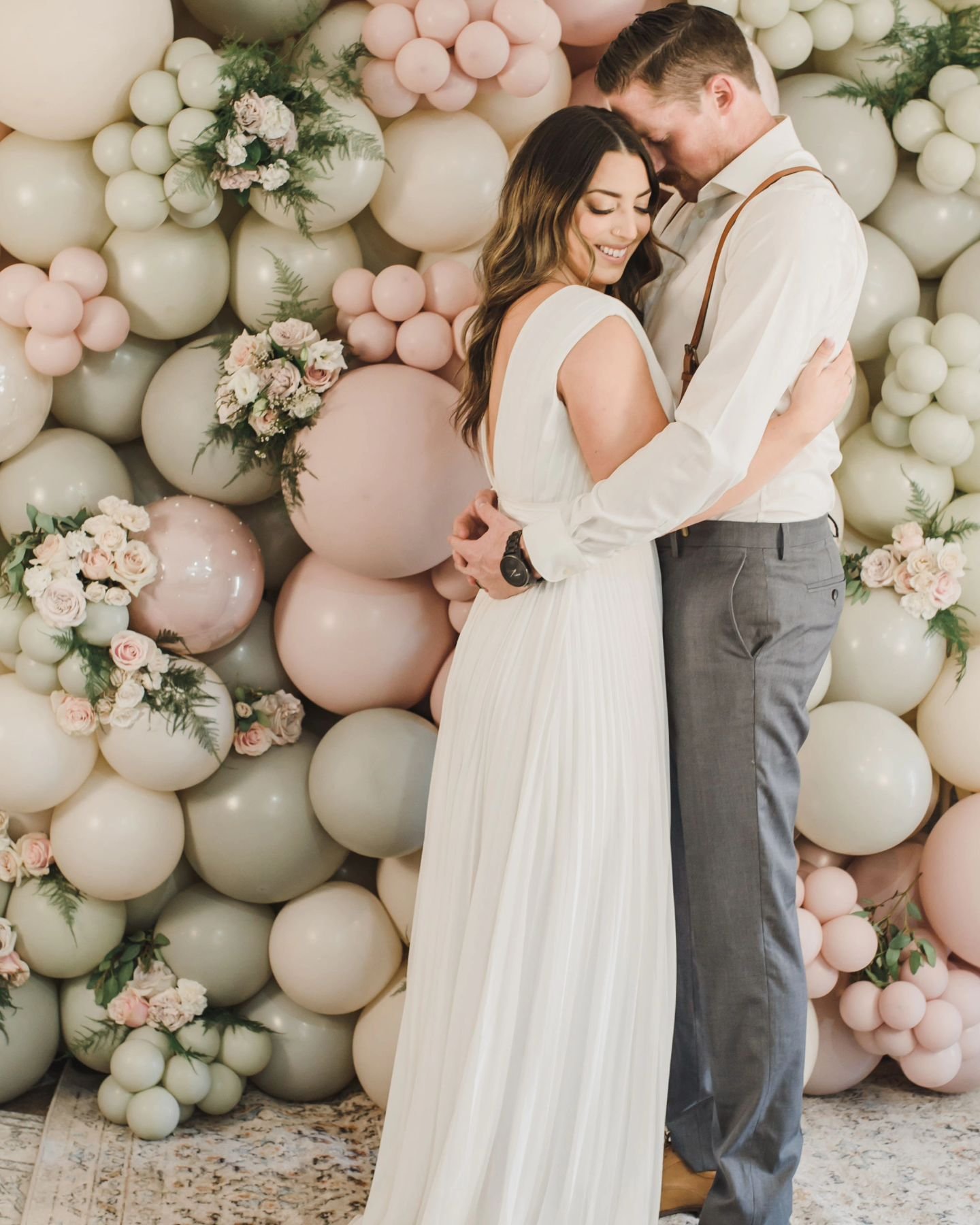 What a fun yet elegant way to add decor to your wedding day. Incorporating your color palette with balloons, adding a soft touch of florals for a  romantic feel. 

This ballon and floral wall can be created as the perfect backdrop for your sweetheart