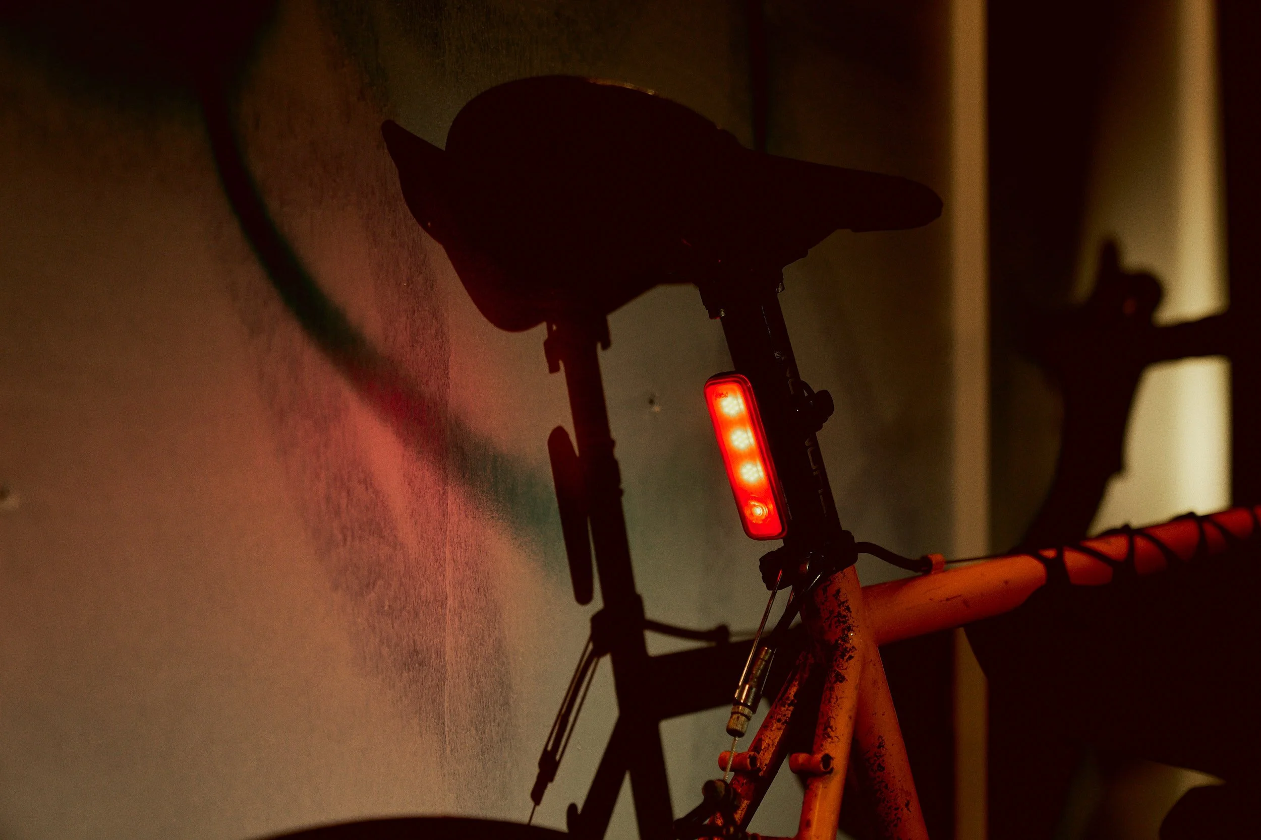 Rear light on a low glowing setting showing off 4 major LEDs running down its centre.