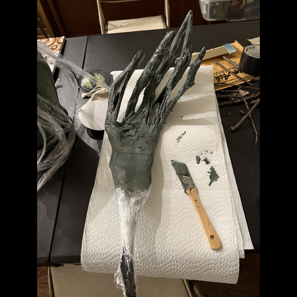 Hand: branches, flower wire, shrink wrap, acryllic