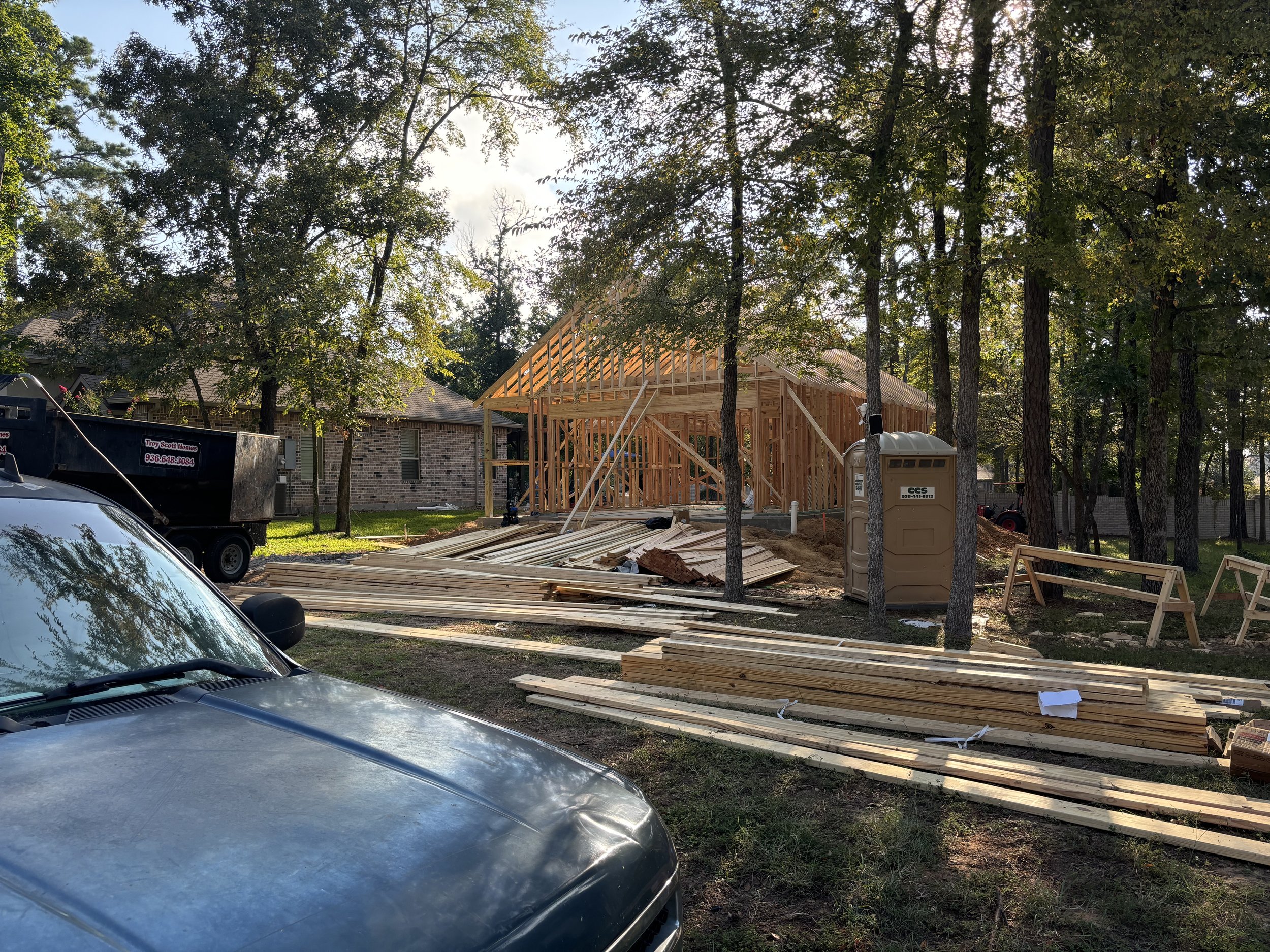 2 down from 313 Pine Brook - Interesting here... The lot is owned by the next door owner, looks like an approx 1500SF structure + 2 car garage. Being built by Troy Scott Homes, who lives in the neighborhood.