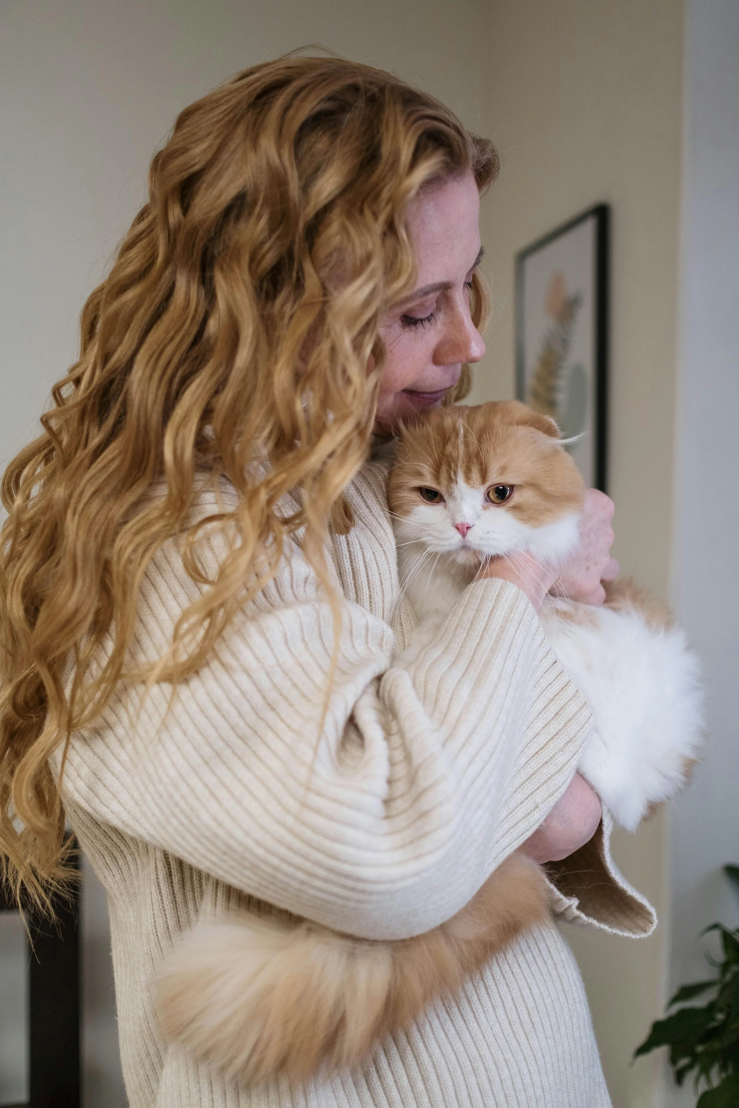 A woman sharing a quiet moment with her cat