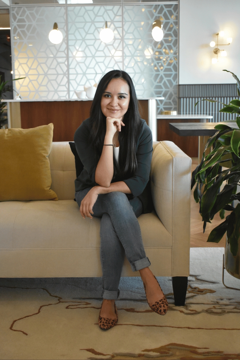 Business manager sitting in a friendly and welcoming manner.