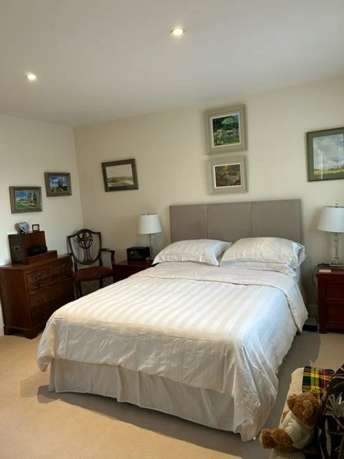 View of the bedroom with a kingsize bed.