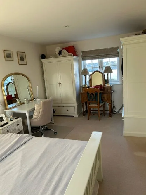 View of king size bed and wardrobe.