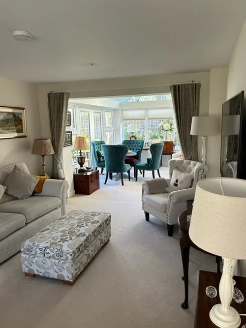 View of the living room with sofa and chair.