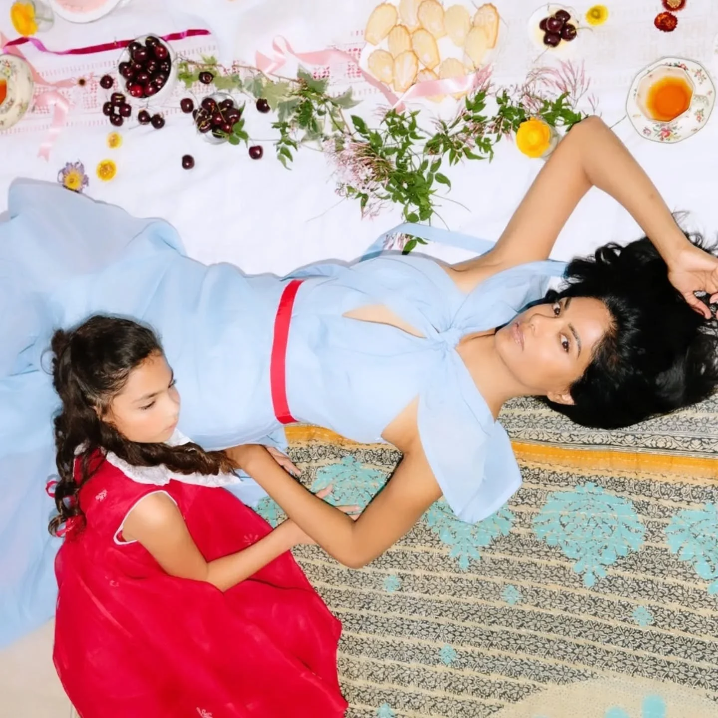 The most beautiful picnic. Children's dress by Naaru &amp; Neeru. Made with a vintage cotton sari with hand embroidery and vintage lace collar. Adult dress by @rosie_assoulin. Photography by @morganpansing. Set and prop design by @lovelyfrancesca