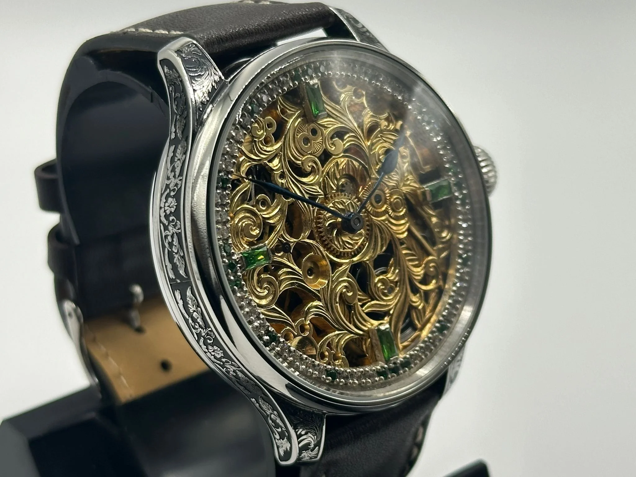 Superb men's 1920's Rolex lever wrist watch, with stunning skeleton dial with diamonds and emeralds.