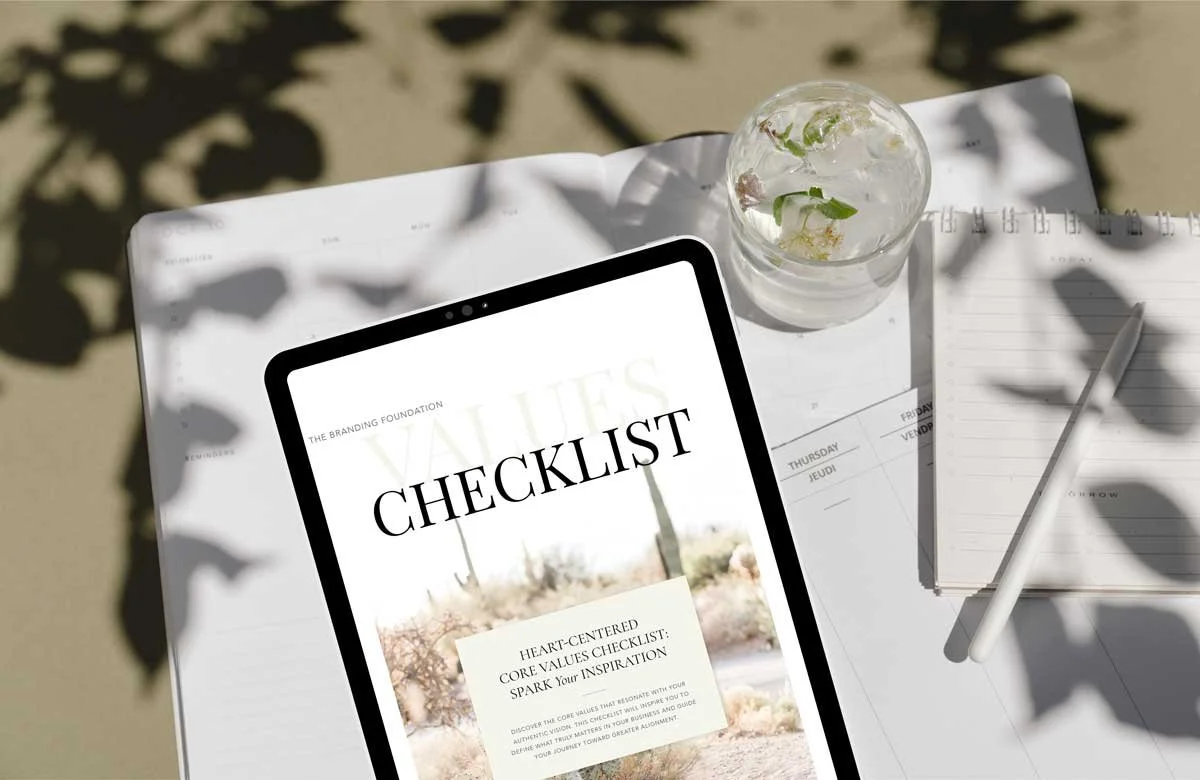 Digital tablet displaying the Sattva Creative Core Values Checklist on a clean, sunlit desk with a mid-year planner, pen, and herbal-infused water, ideal for entrepreneurs reflecting on values, vision, and intentional growth.