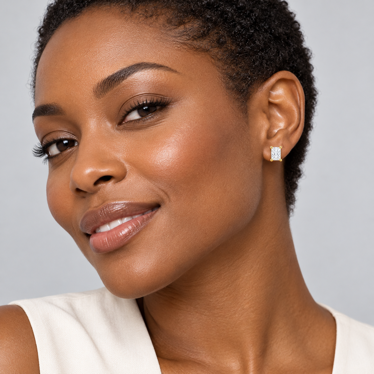 Prism Rectangular Studs in yellow gold worn on a model, illustrative styling concept