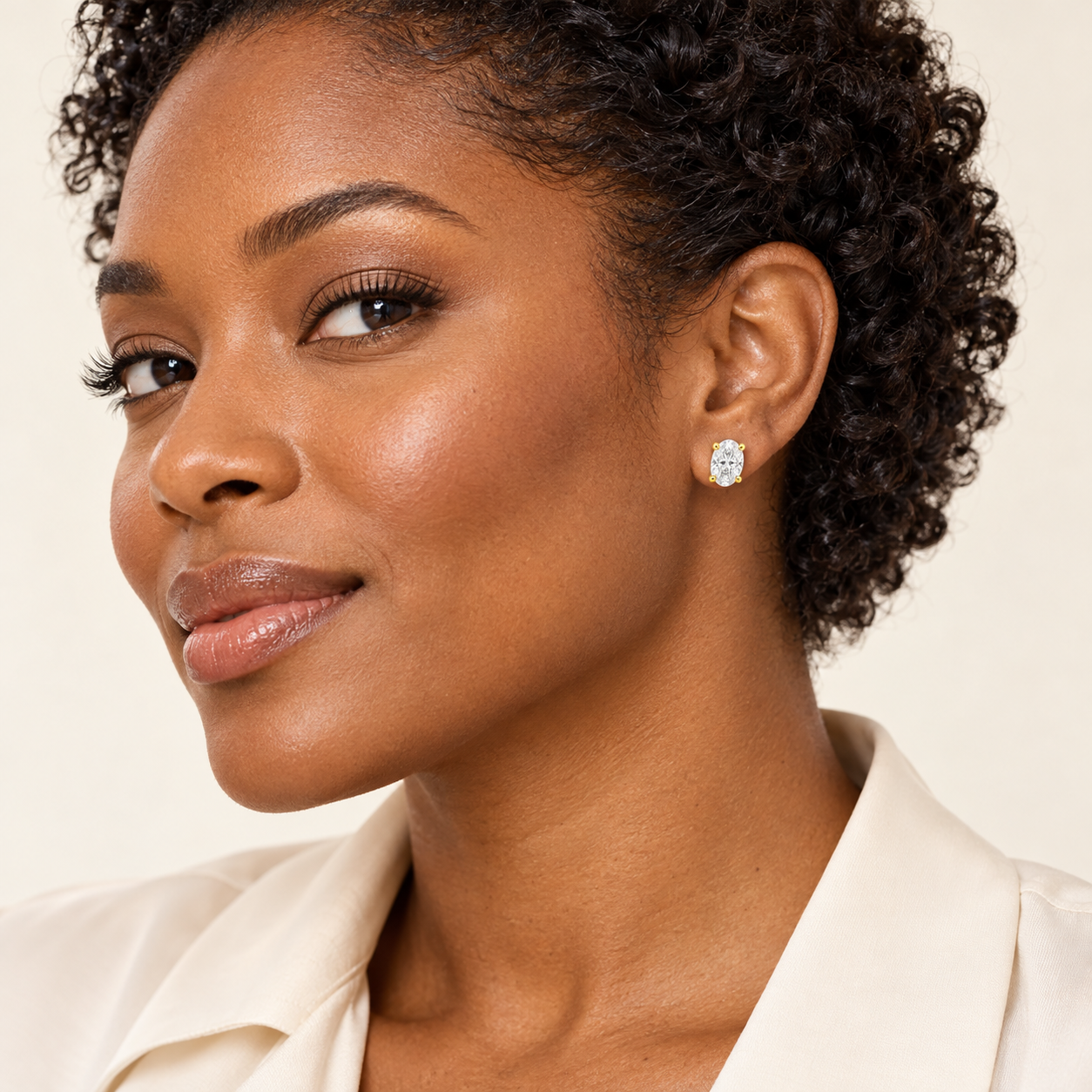 Ellipse Oval Studs in yellow gold worn on a model, styling concept.