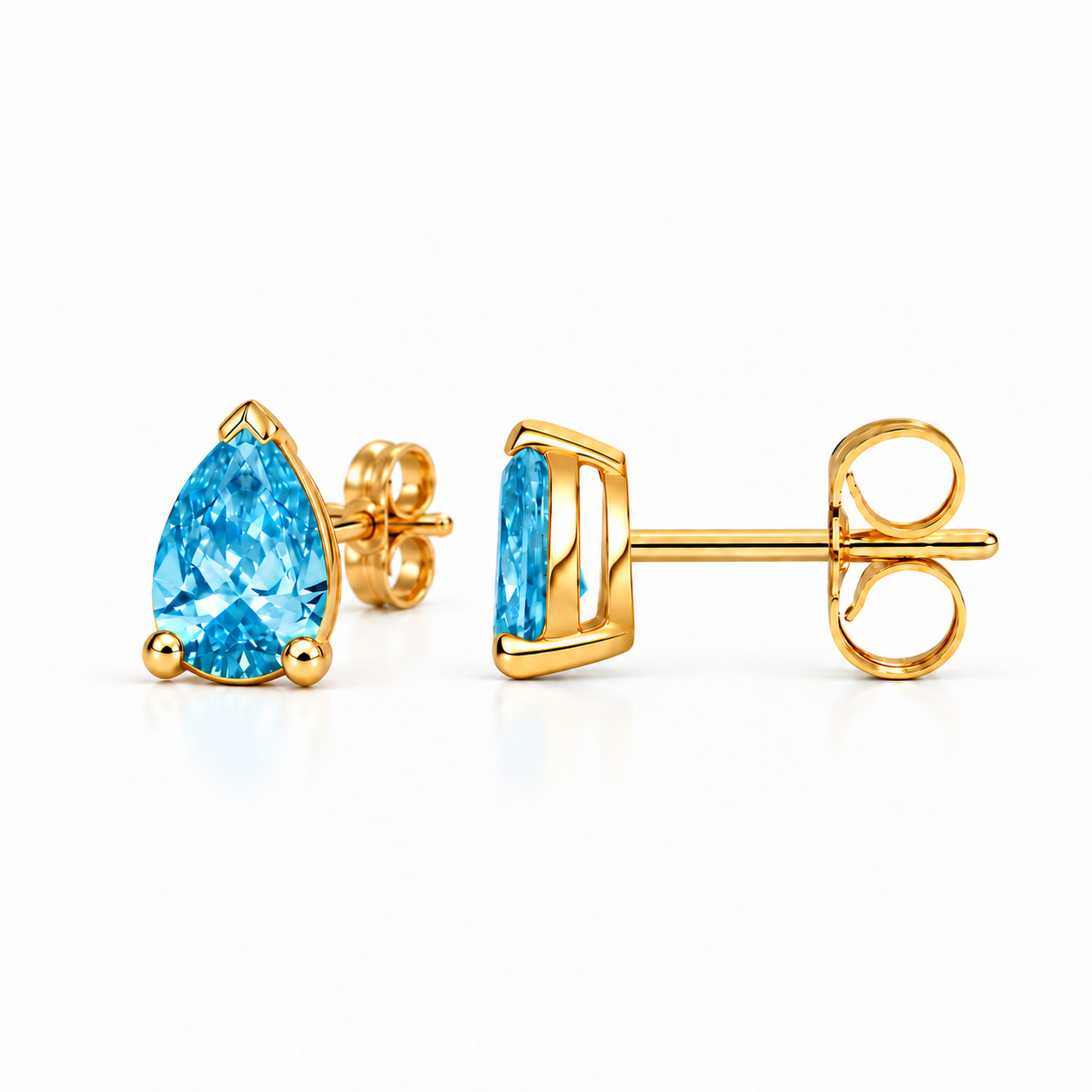 Azure Pear Studs in yellow gold, revised alternate view with a gently turned blue pear stone and its mate in side profile, showing straight posts and attached butterfly backs.