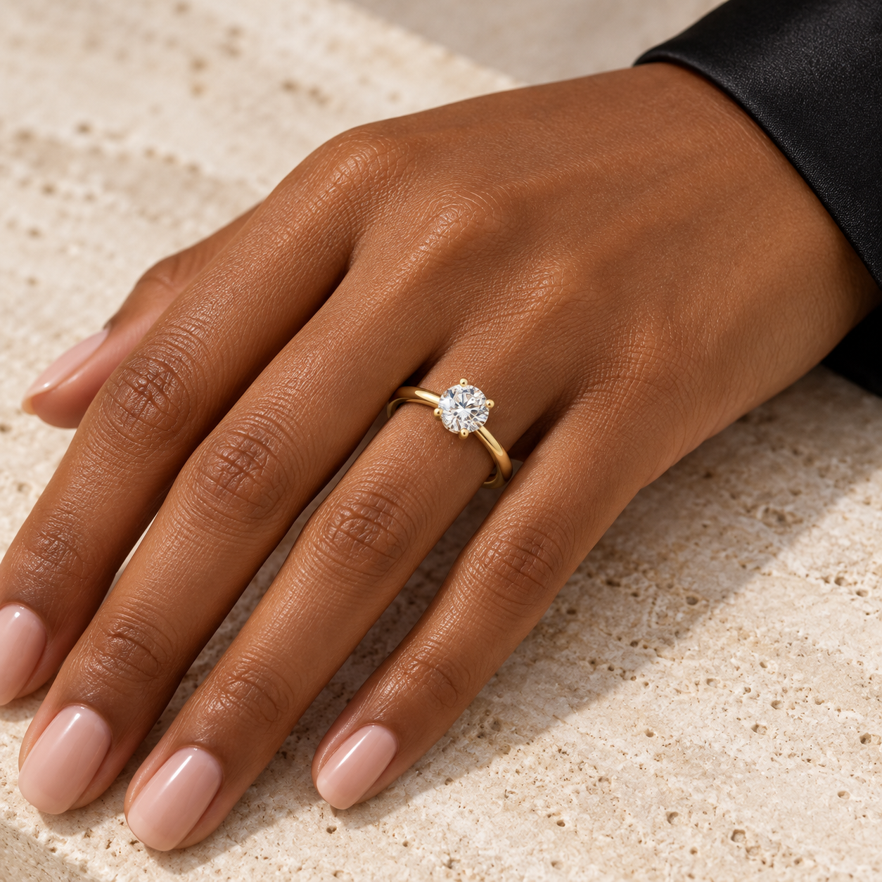 Woman wearing the yellow gold Seren Solitaire Ring, styling concept
