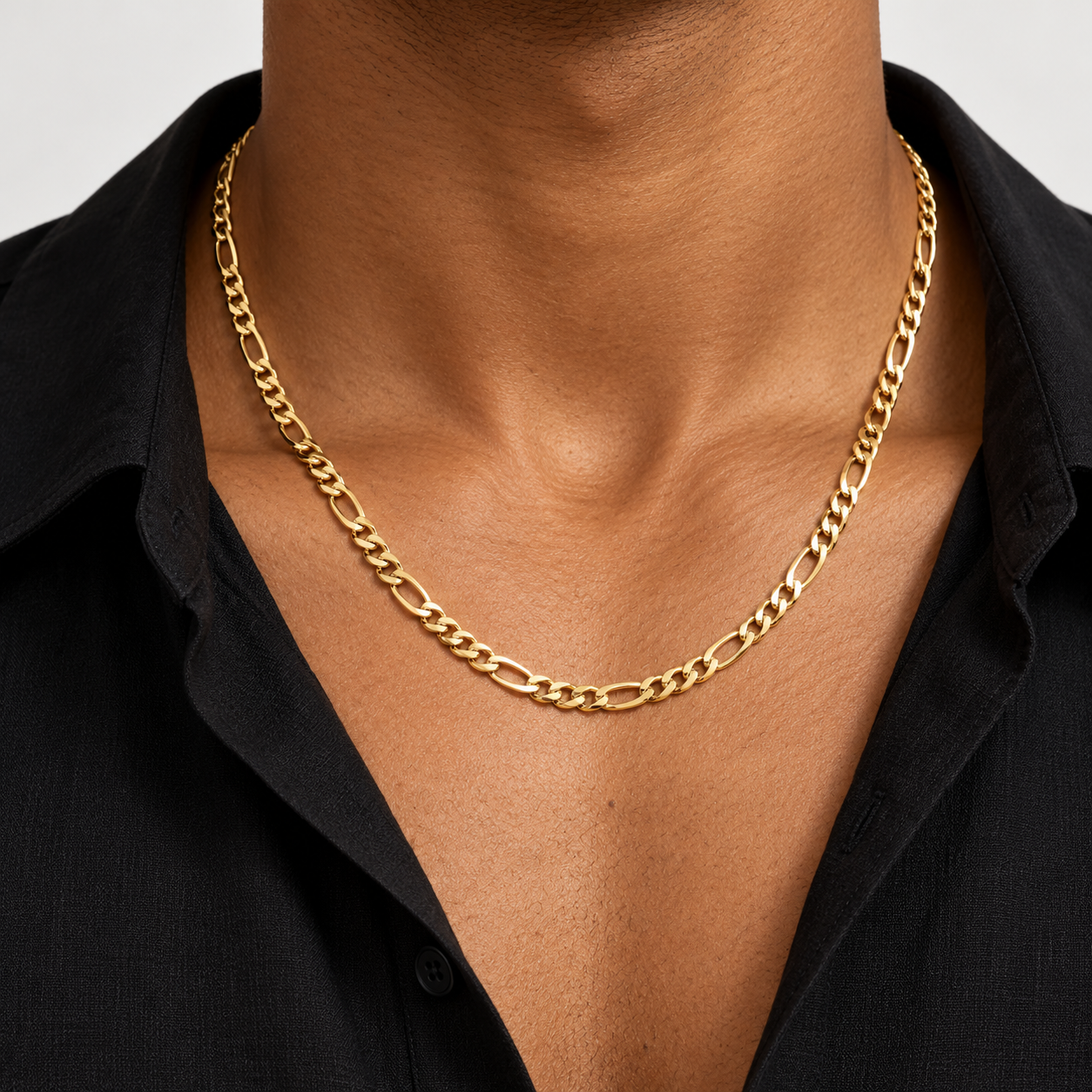 Man wearing the yellow gold Figaro Link Necklace, styling concept