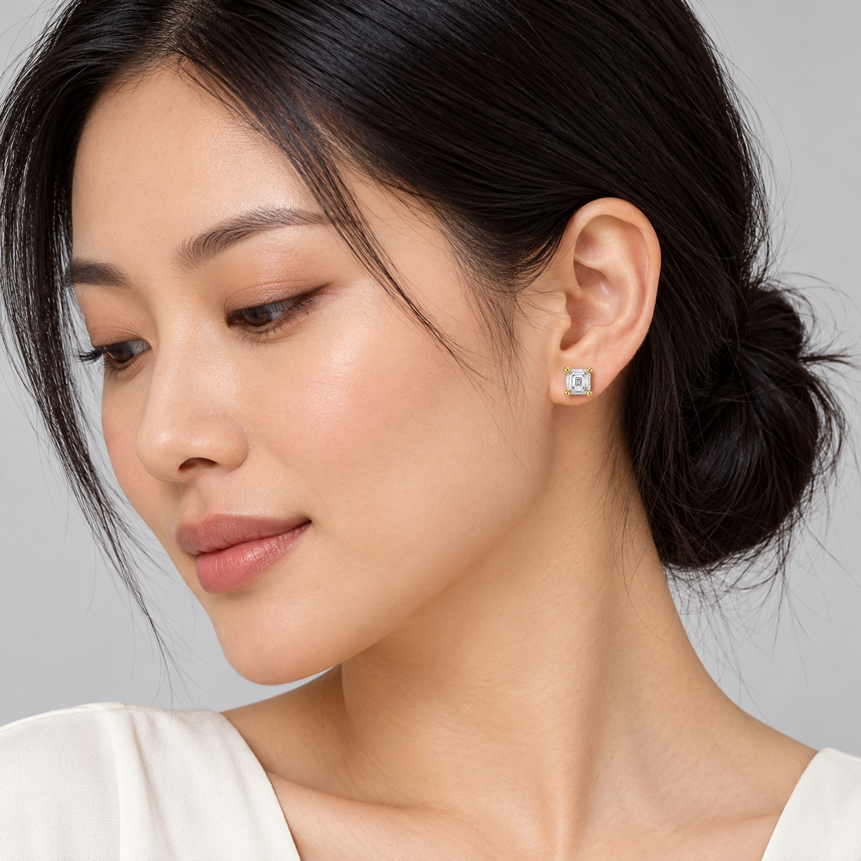 Octave Step-Cut Studs in yellow gold worn on a model, illustrative styling concept