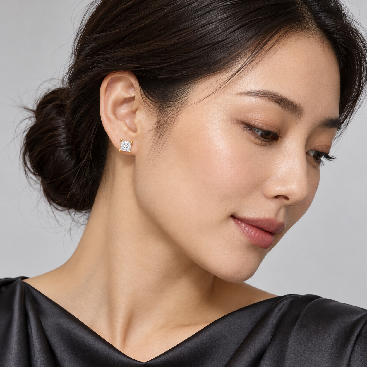 Carré Princess Studs in yellow gold worn on a model, illustrative styling concept