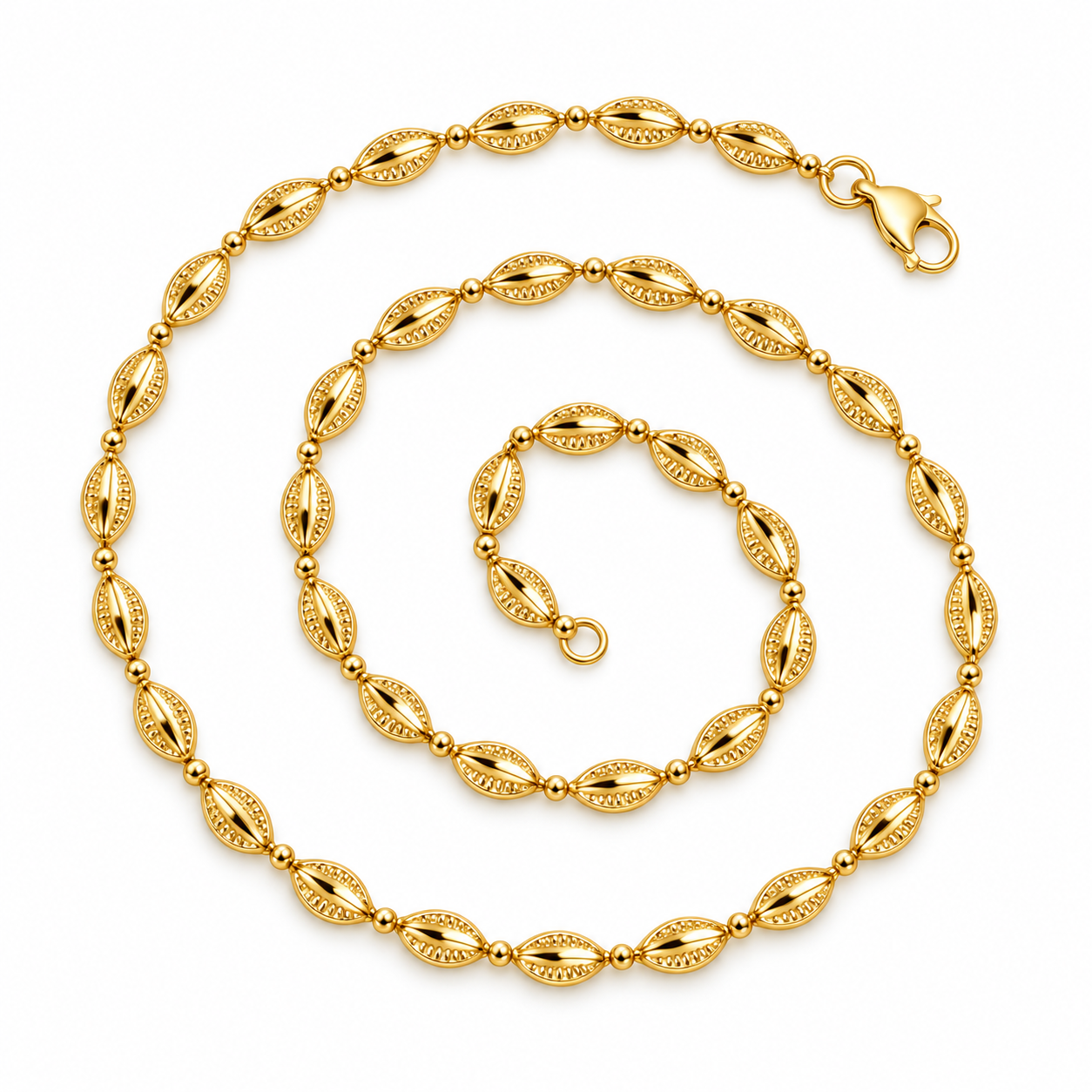 Golden Cowrie Necklace in yellow gold, arranged in an open spiral with a lobster clasp.
