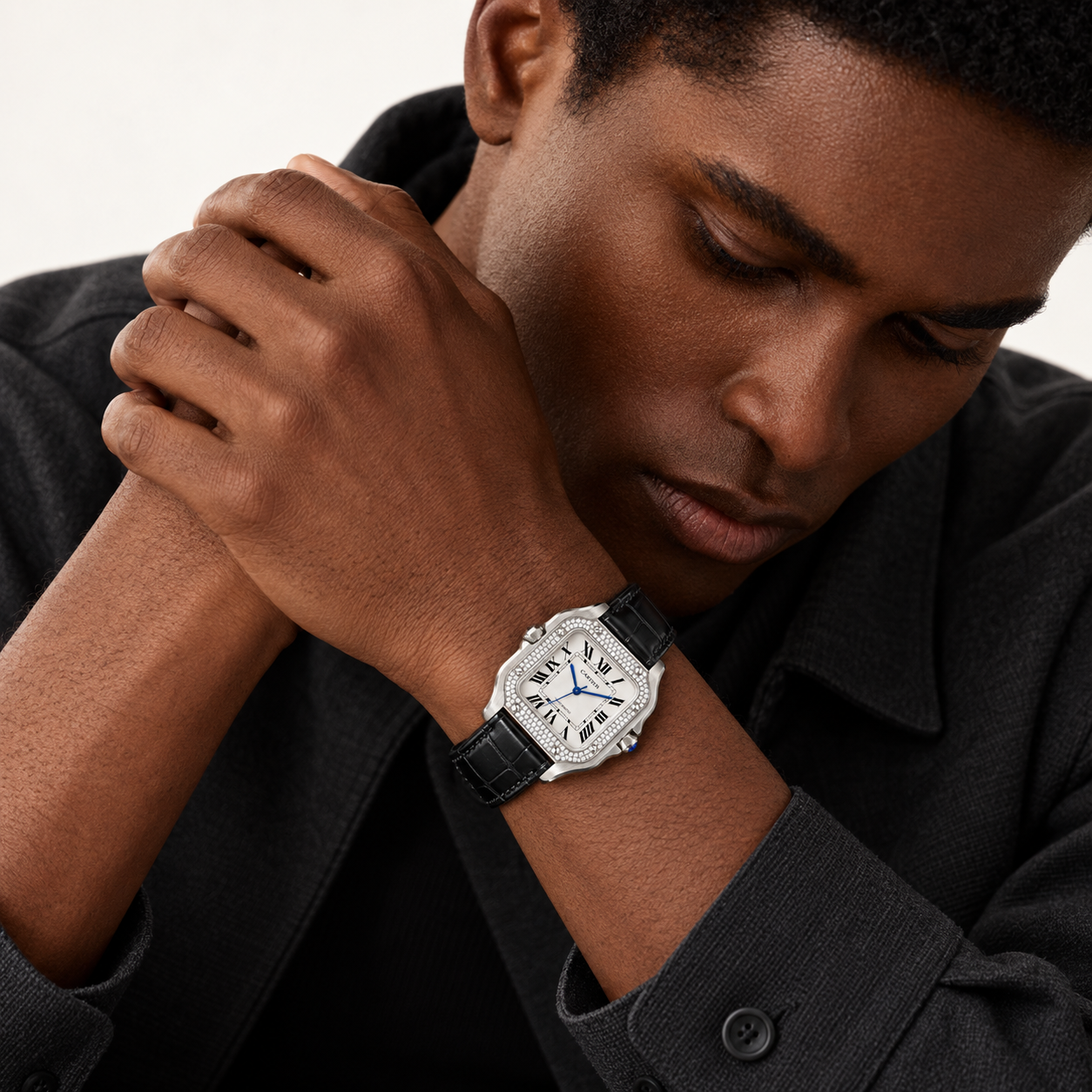 Man wearing the Santos de Cartier pavé bezel watch with black crocodile strap