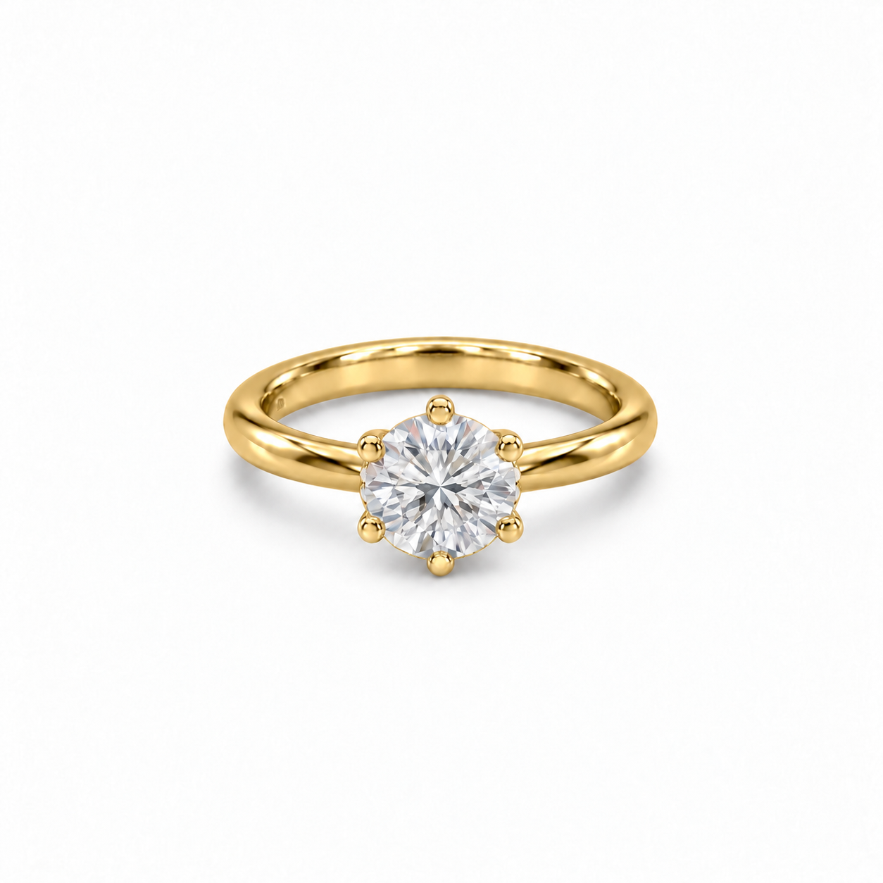 Seren Solitaire Ring in yellow gold, flat view showing open basket and hidden diamond collar