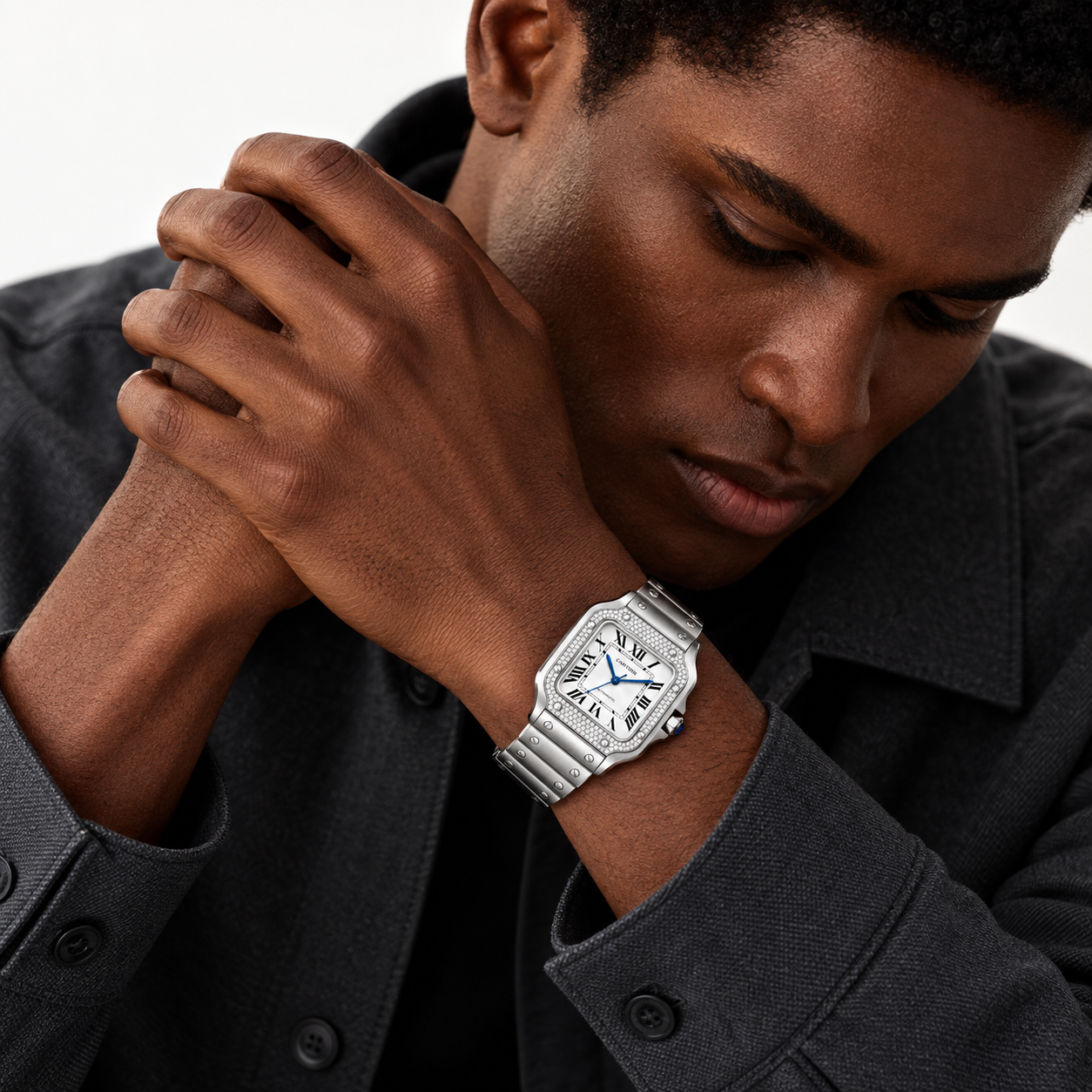 Man wearing the Santos de Cartier pavé bezel watch with steel bracelet