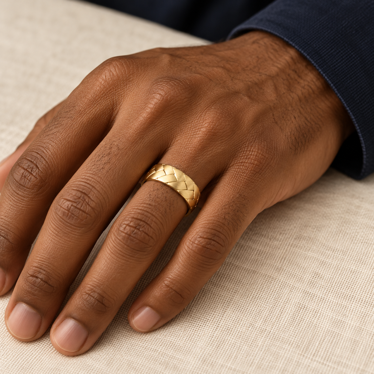 Yellow gold Facet Weave Band worn on a hand.