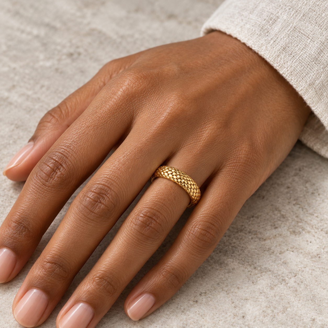 Dragon Scale Band in yellow gold, worn on a hand