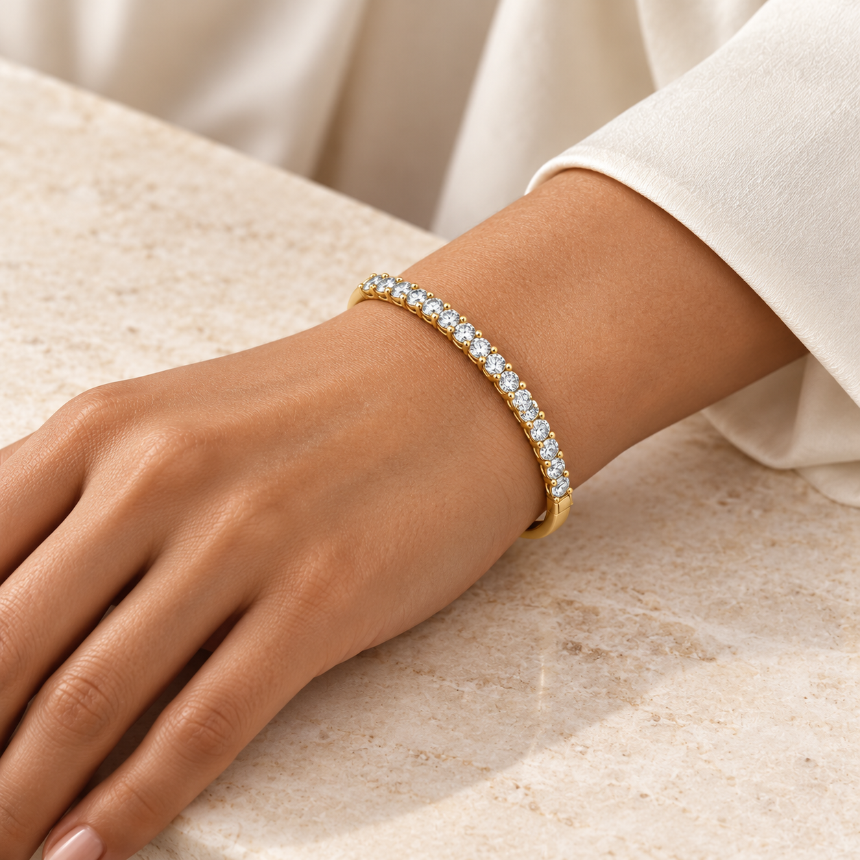 Lumière Diamond Bangle in yellow gold worn on a wrist, illustrative styling concept