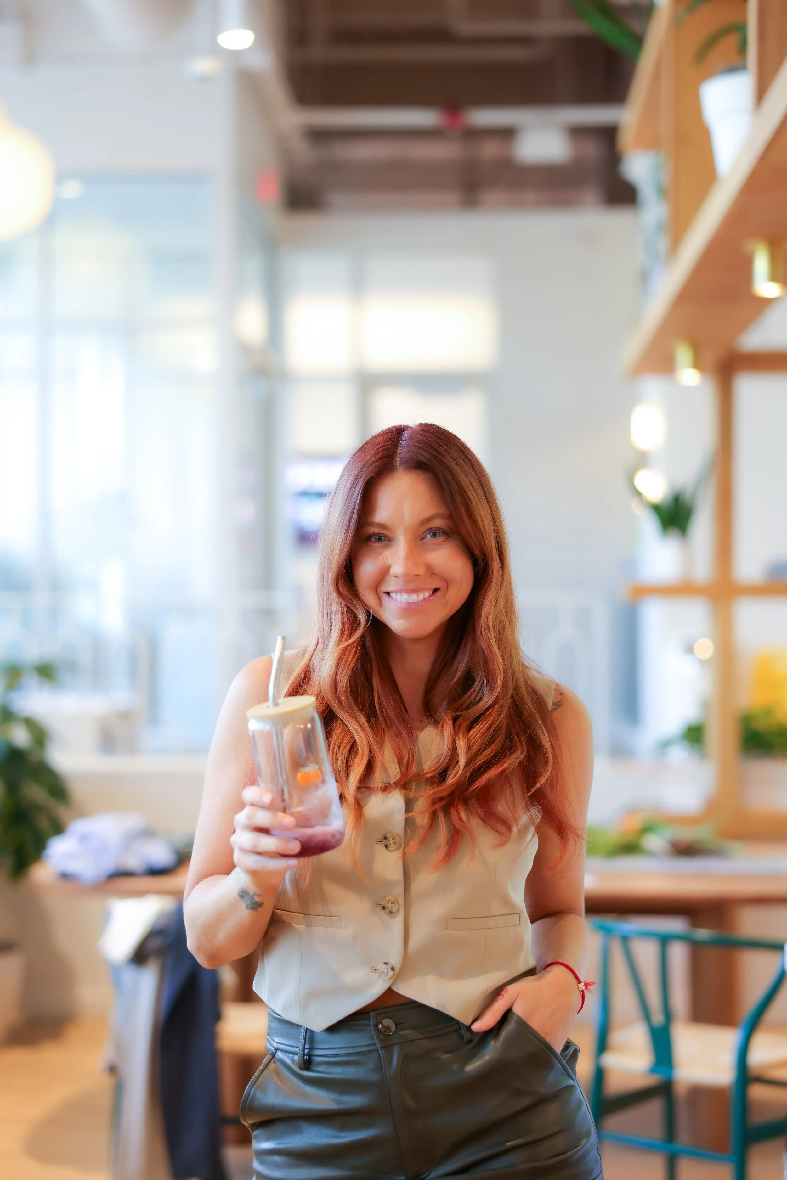 Alison Thacker, Founder of TheCheekyClean Lifestyle Detox Program, is an ingredient expert; she holds a healthy smoothie.