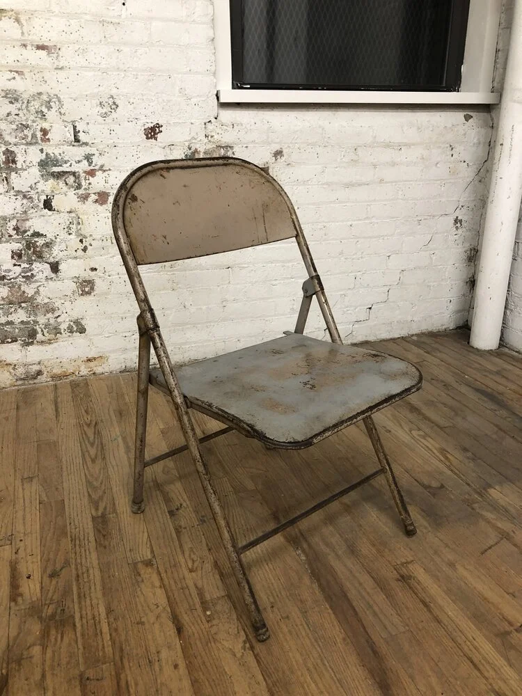 FC141 Distressed Metal Folding Chair — Primate Props