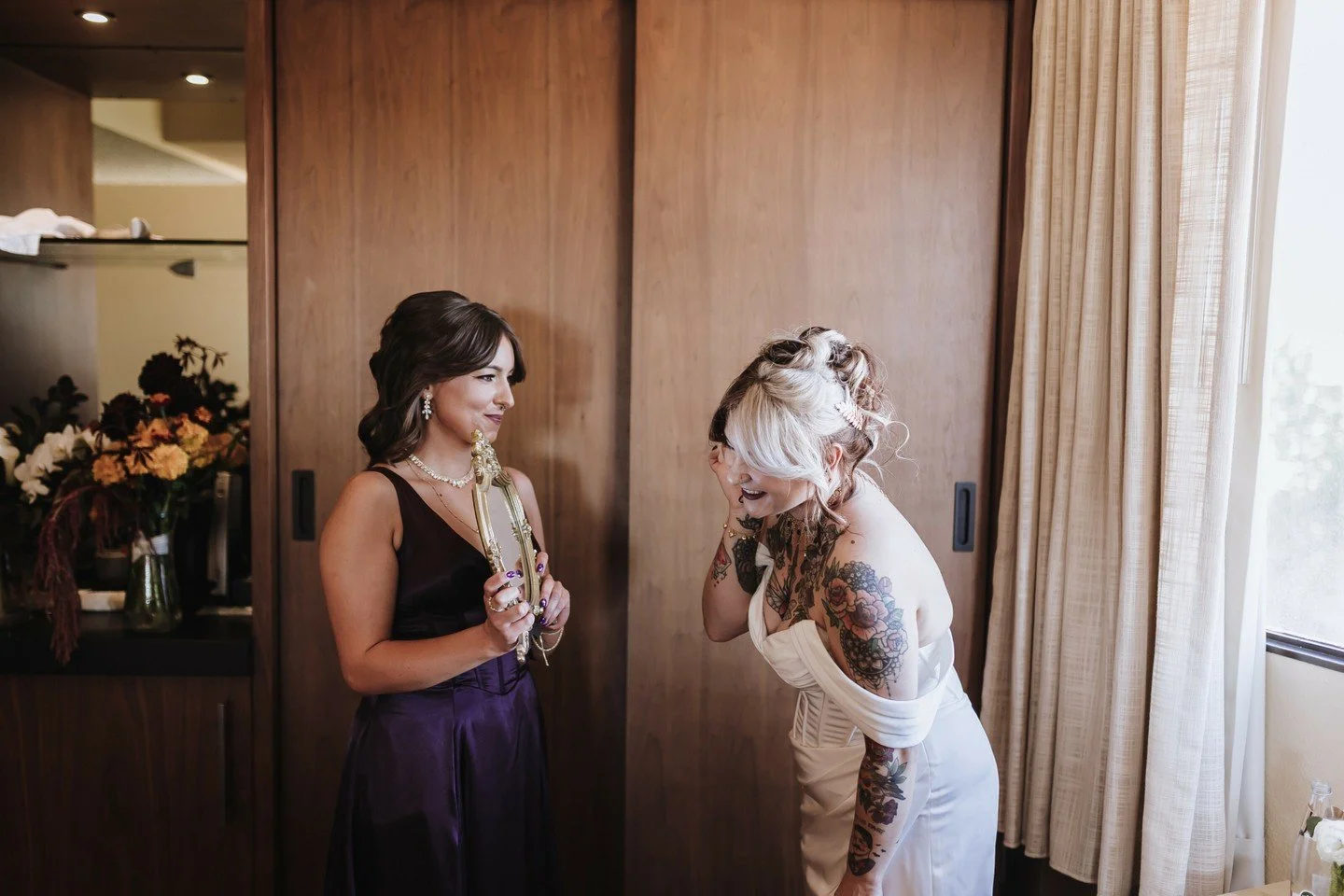 Surrounded by her biggest cheerleaders, she said &quot;I do&quot; to her high school sweetheart.

The centerpices for their recption were unique with fresh fruit, old books (that guests could take home), candles, and flowers. Each table was designed 