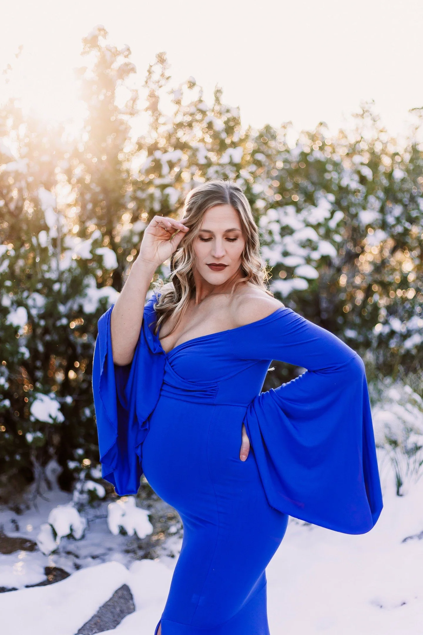We caught the snow for Tessa's maternity session in the foothills this past weekend. She chose this bright blue and two other dresses that deserve their own spot on the grid.

Don't wait to book your maternity session! These are best done between 32-