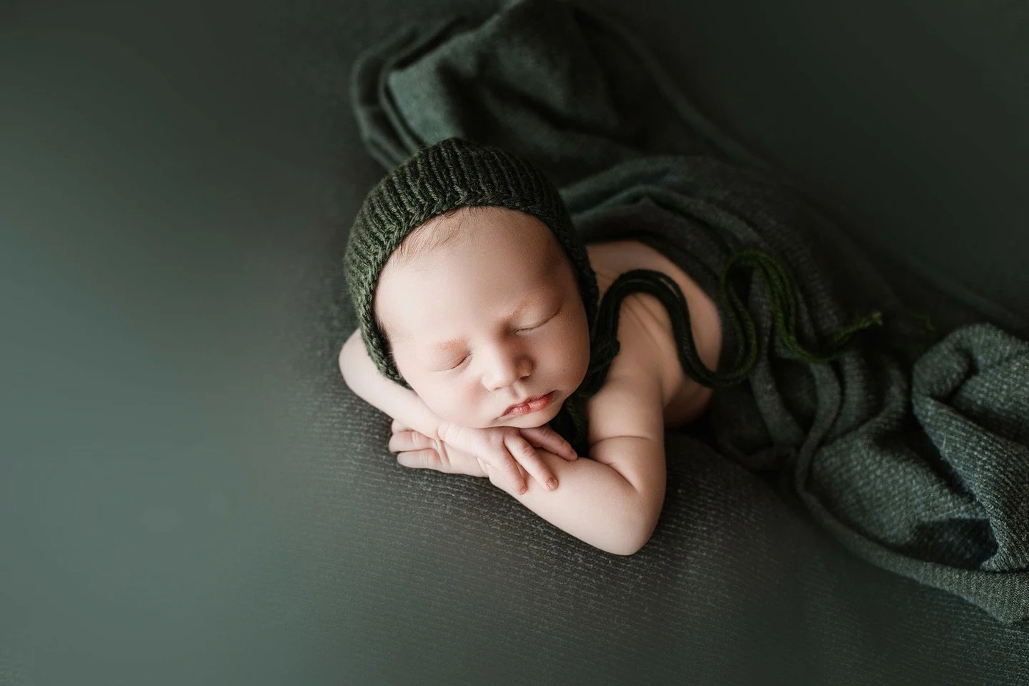 There is nothing sweeter than those quiet newborn days when the world slows down and everything feels brand new.

This little guy slept so peacefully through his studio newborn session, and those tiny fingers and soft curls are the moments parents ne