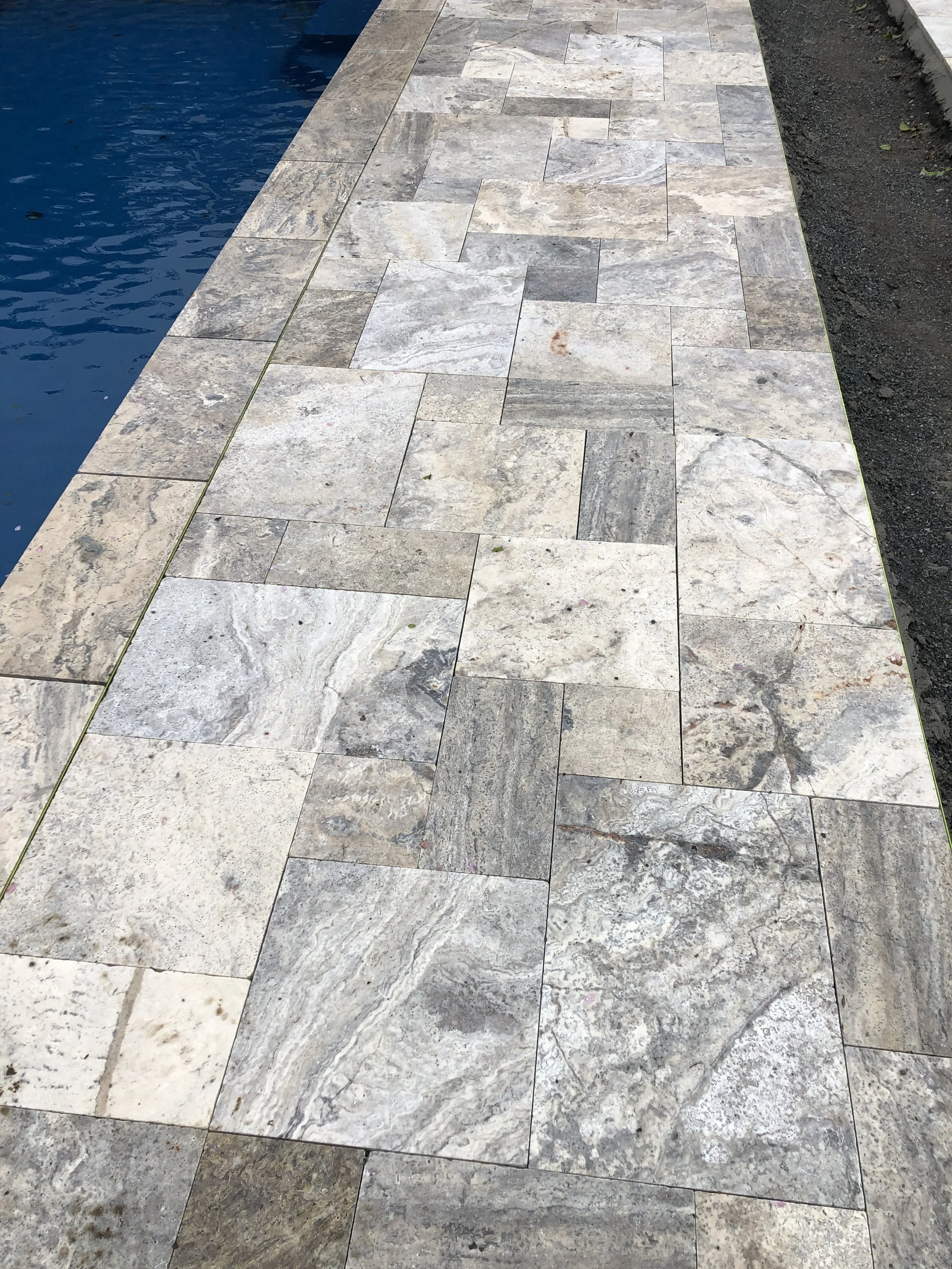 Silver Travertine Dropface Coping with French Pattern Paving
