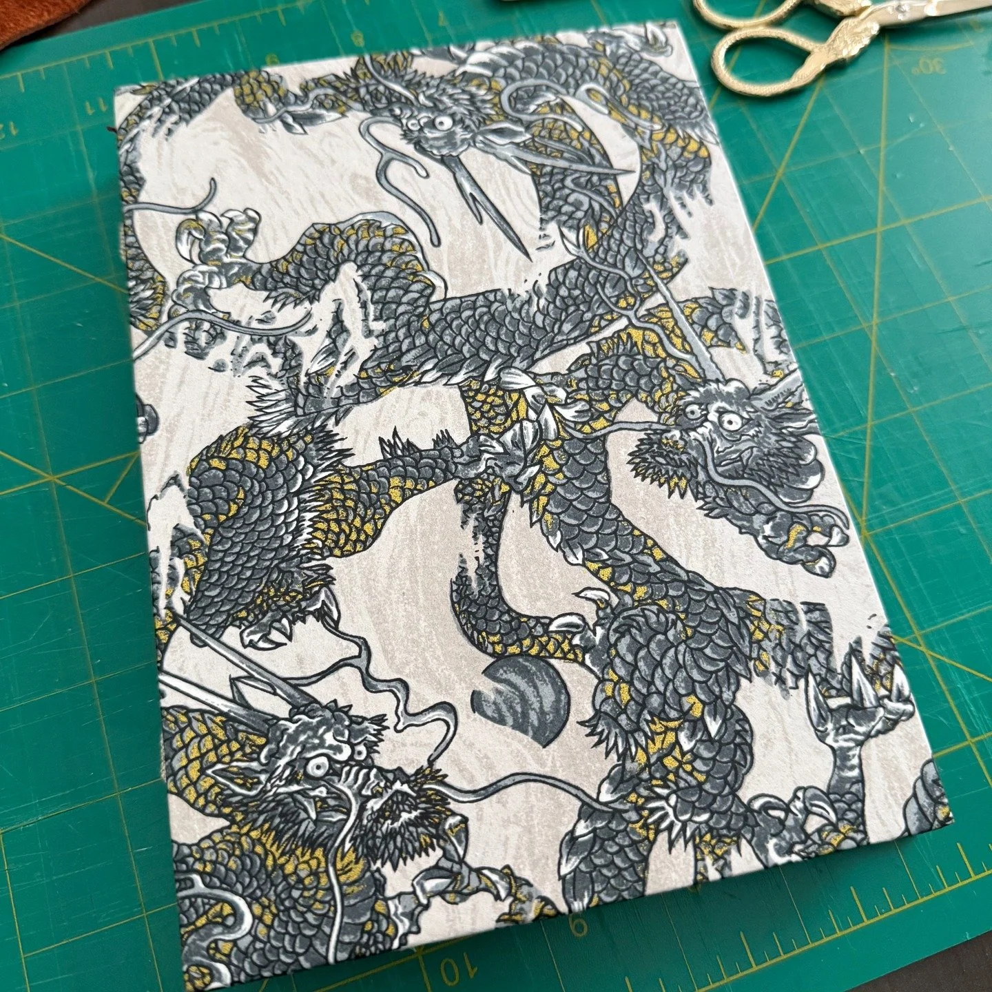 A new hardcover journal is available in my shop! 

In China, dragons are traditionally thought to be associated with water and weather. They rule over bodies of moving water, like rivers and waterfalls, and they control rain. I made this journal with