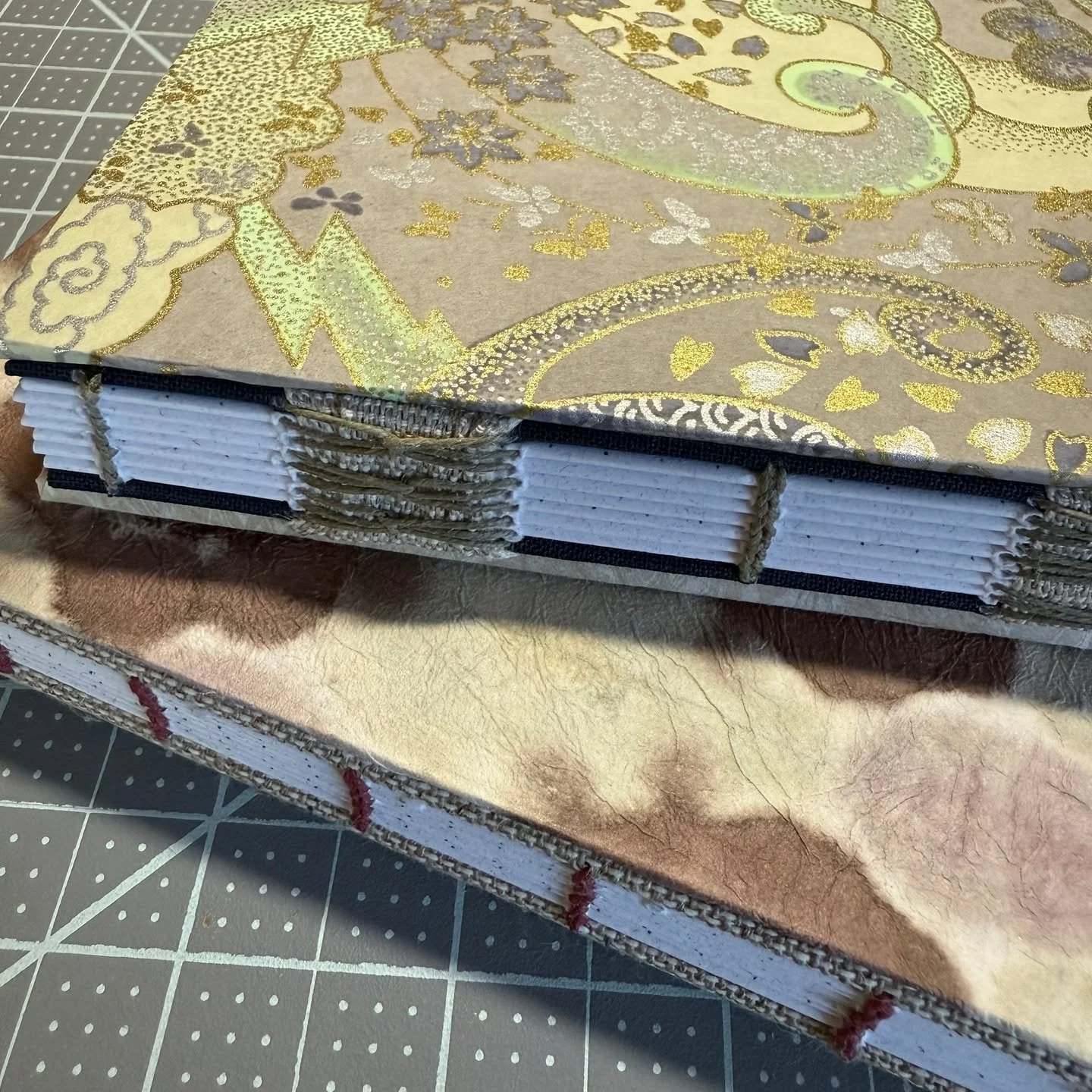 Making lots of journals/notebooks for my shop! I'm having a drop on January 31, when all my creations this month will be up for sale on my website melaniermeadors.com.